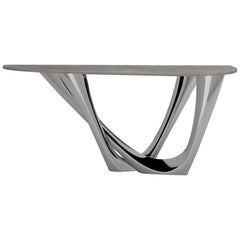 Tavolo G-Console Duo in acciaio inox lucido con piano in cemento, Zieta