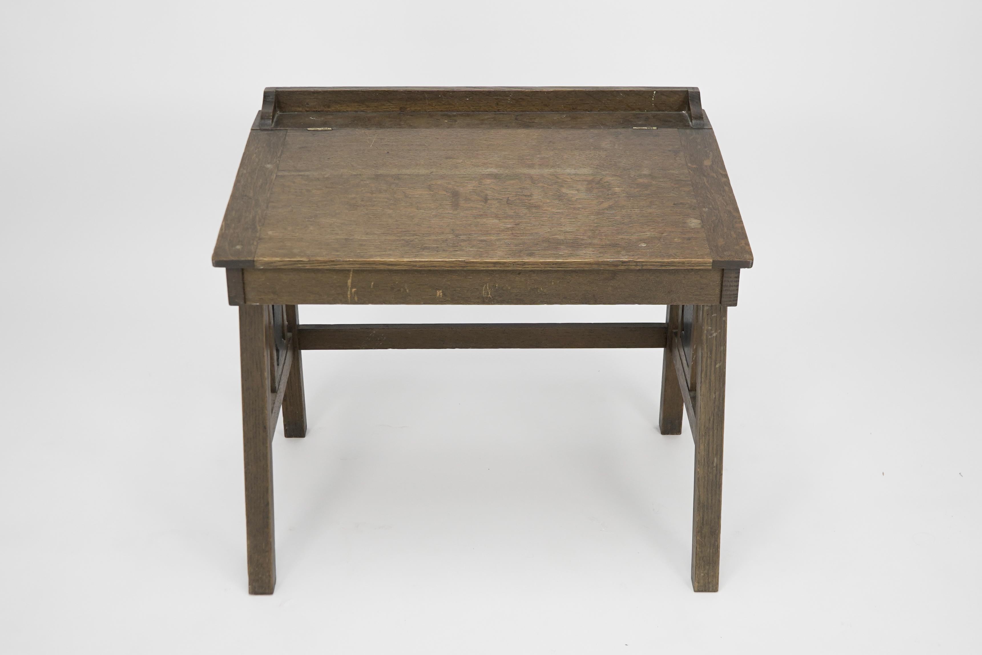 English G F Hardy. An oak childs desk with a slanted writing area and storage underneath For Sale