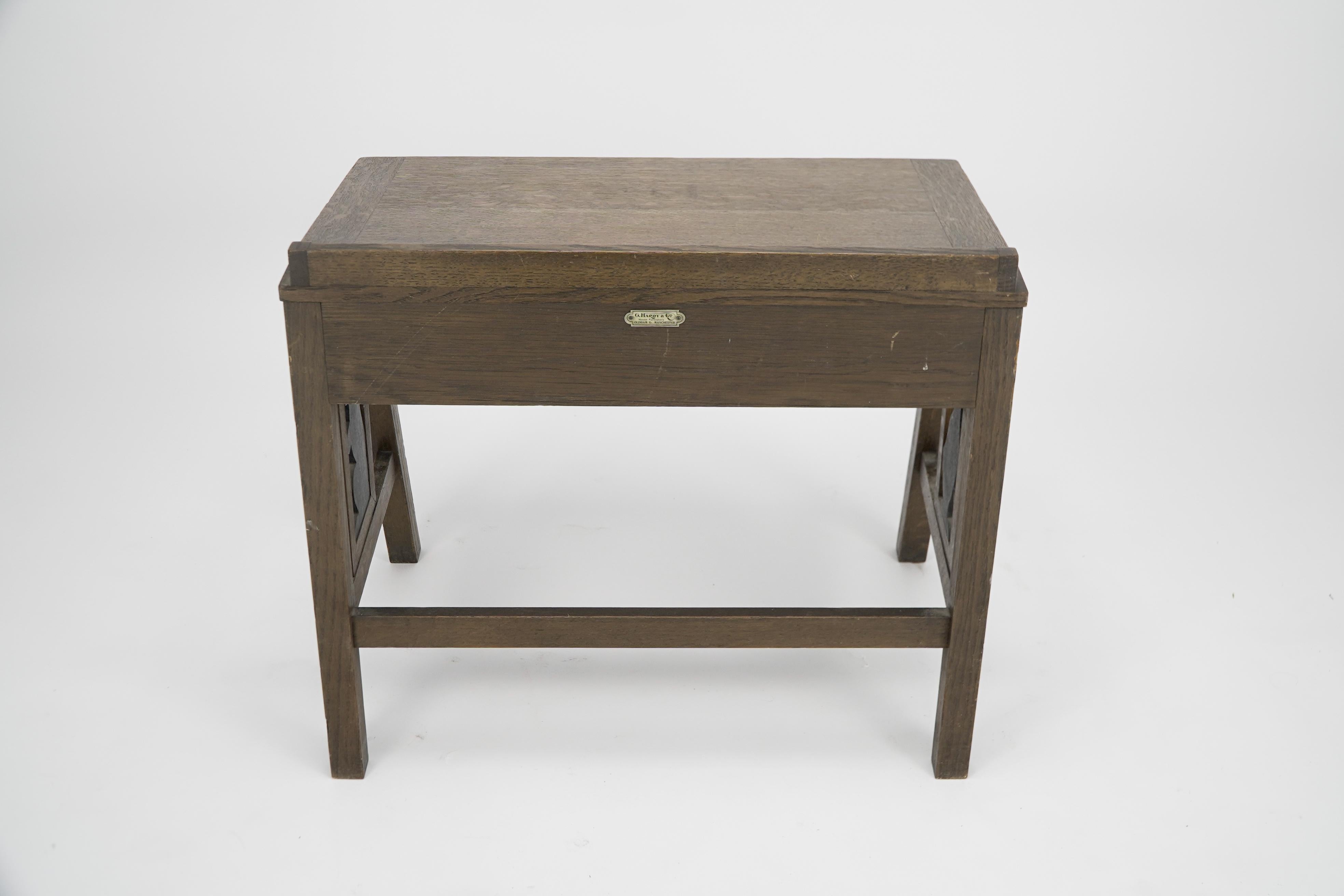 G F Hardy. An oak childs desk with a slanted writing area and storage underneath For Sale 1