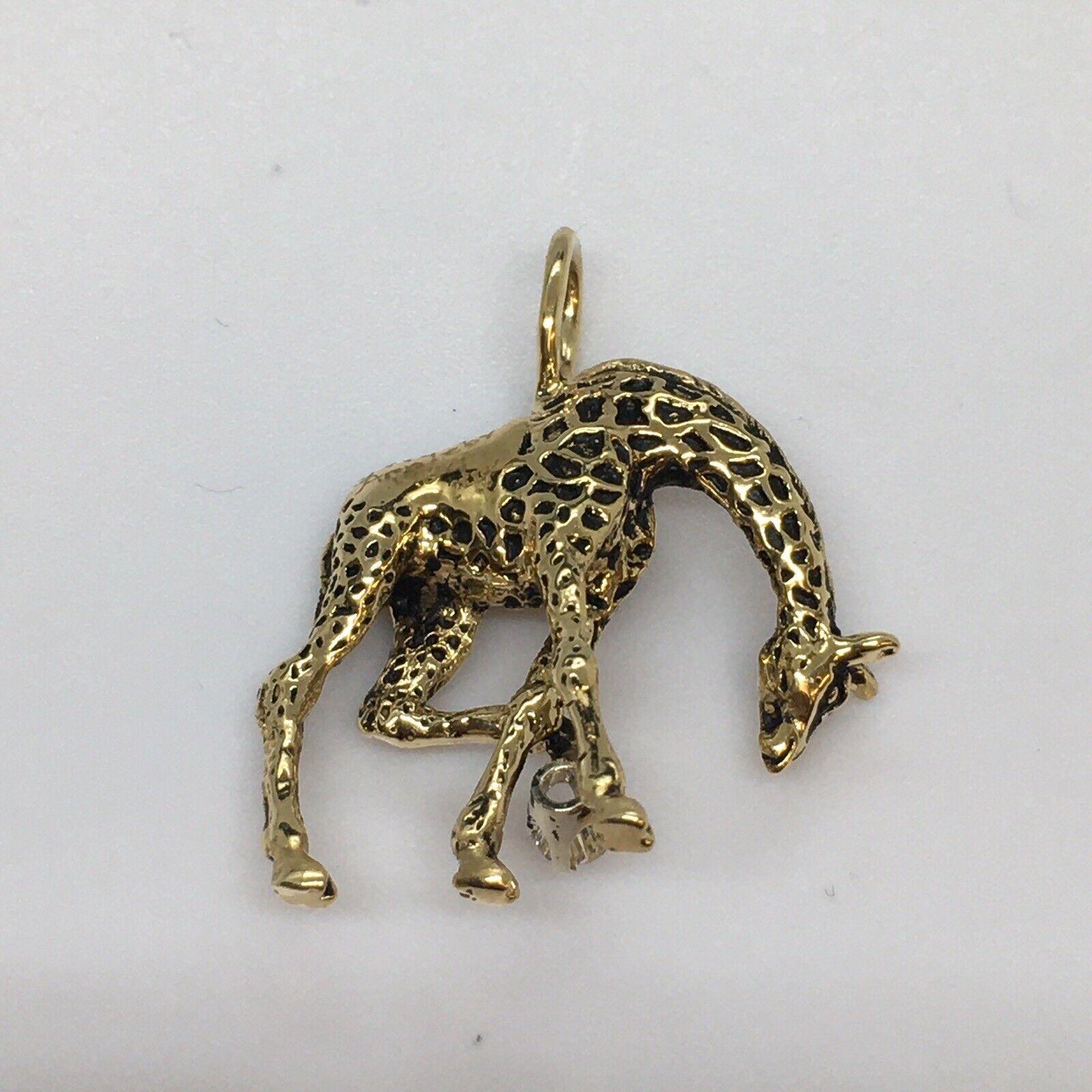 G & G Appleby 14 Karat Yellow Gold Diamond and Enamel Walking Giraffe Necklace

Gregory A. Appleby born in Van Nuys, Ca. He partnered with Gayle Bright and began sculpting precious metal jewelry. Their work has been featured in many galleries. 