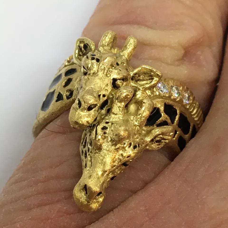 G & G Appleby 18 Karat Yellow Gold Diamond and Enamel Double Giraffe Ring


Gregory A. Appleby born in Van Nuys, Ca. He partnered with Gayle Bright and began sculpting precious metal jewelry. Their work has been featured in many galleries.  Gayle