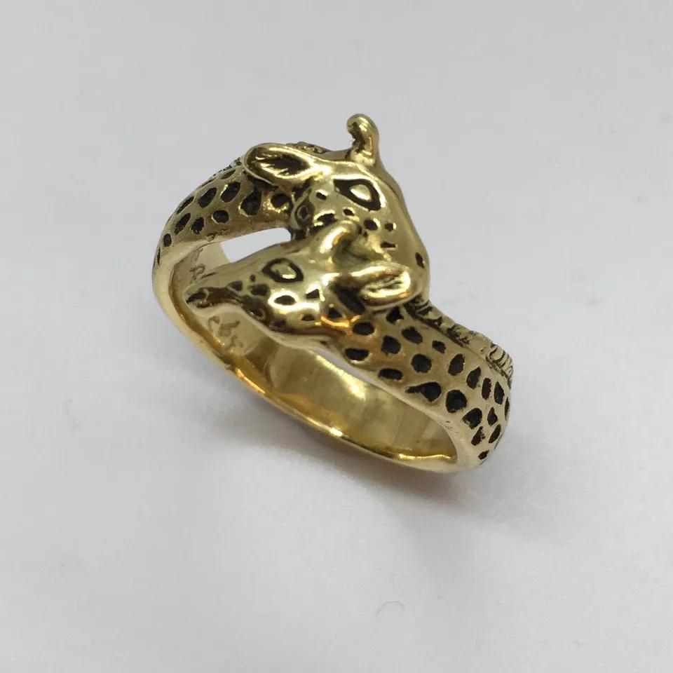 G & G Appleby 18 Karat Yellow Gold  Enamel Double Giraffe Ring

Gregory A. Appleby born in Van Nuys, Ca. He partnered with Gayle Bright and began sculpting precious metal jewelry. Their work has been featured in many galleries.  Gayle and Gregory