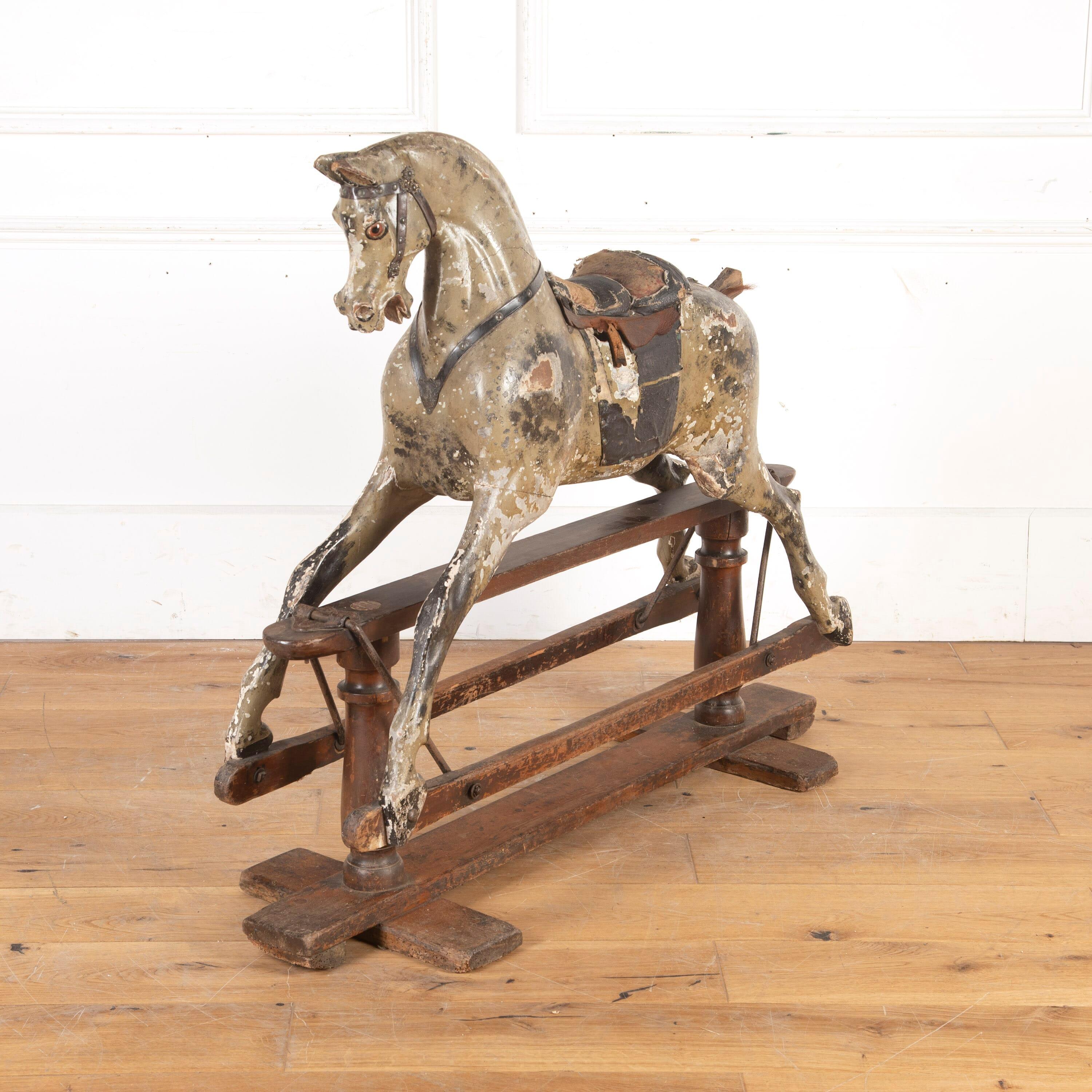 
Wonderful 19th Century nursery rocking horse by G. J. Lines. 

This charming horse features a wonderfully detailed head, with a dished face and flared nostrils. 

He retains his original saddle and leather strapping to the bridle, as well as