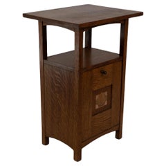 G M Ellwood for J S Henry. A rare oak and inlaid coal purdonium