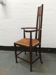G M Ellwood for J S Henry, an English Art Nouveau Armchair with Stylized Inlays