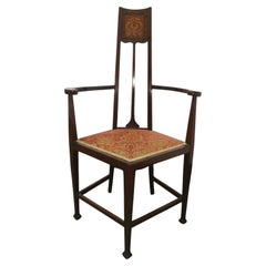 G M Ellwood pour J S Henry, un fauteuil Art nouveau anglais avec incrustations stylisées
