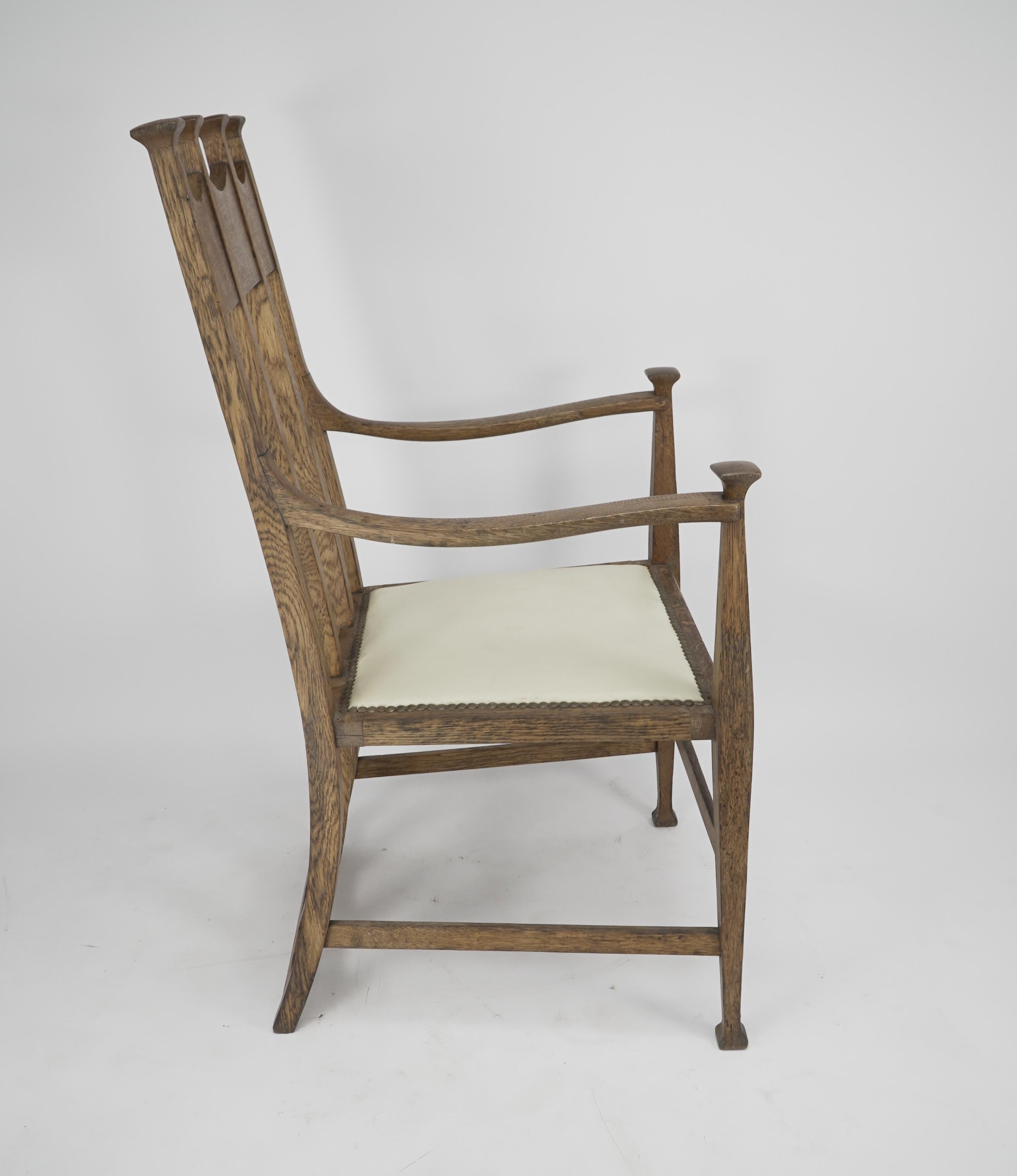 English G M Ellwood for J S Henry. Arts & Crafts oak throne armchair with capped finials For Sale