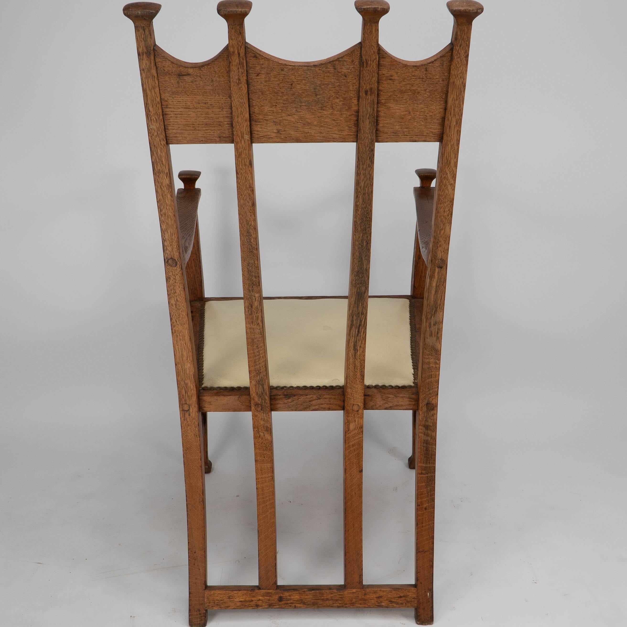 G M Ellwood for J S Henry. Arts & Crafts oak throne armchair with capped finials For Sale 4