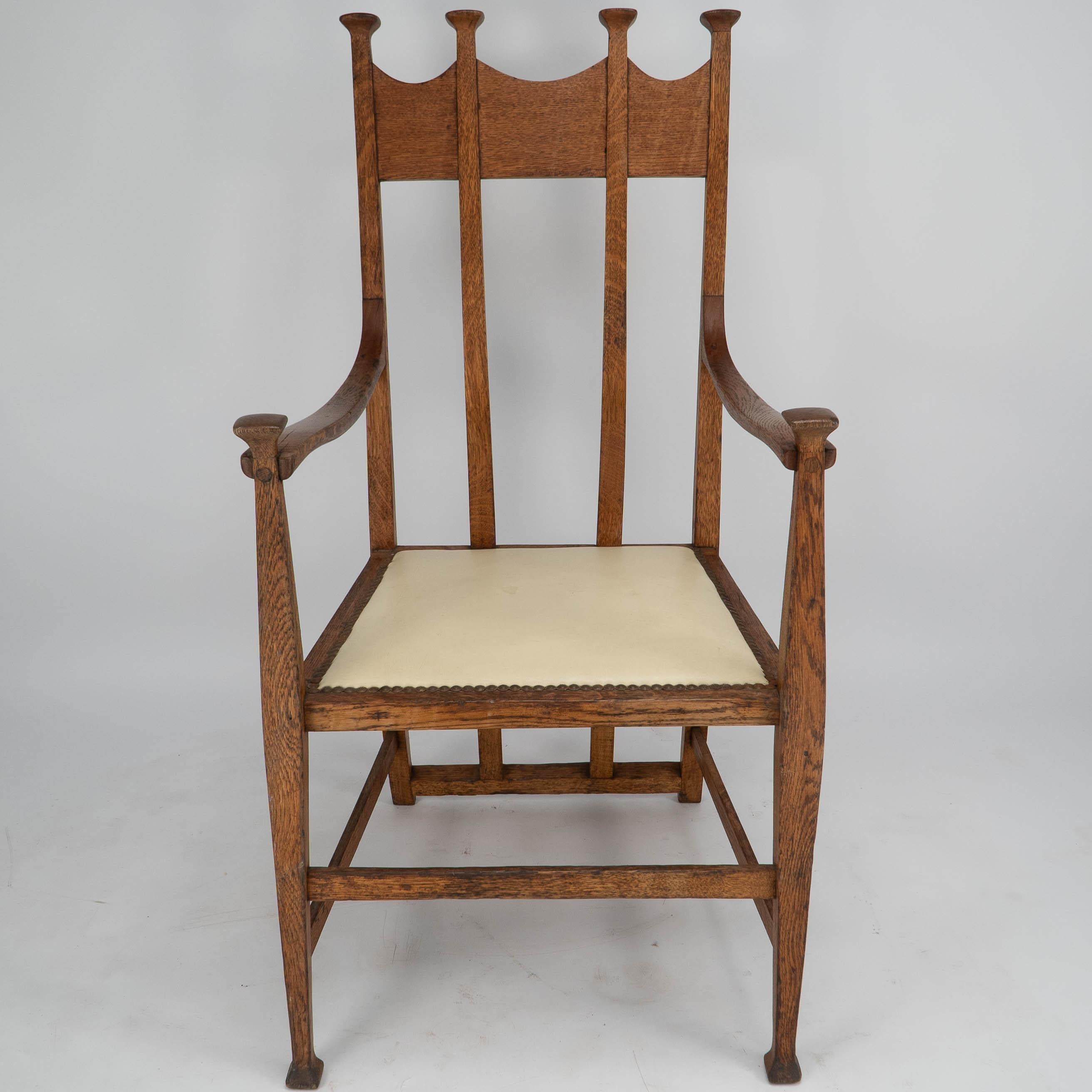 George Montague Ellwood. Made by J S Henry.
An Arts & Crafts oak throne armchair with capped finials and wonderful sweeping back supports, on tapering square legs.