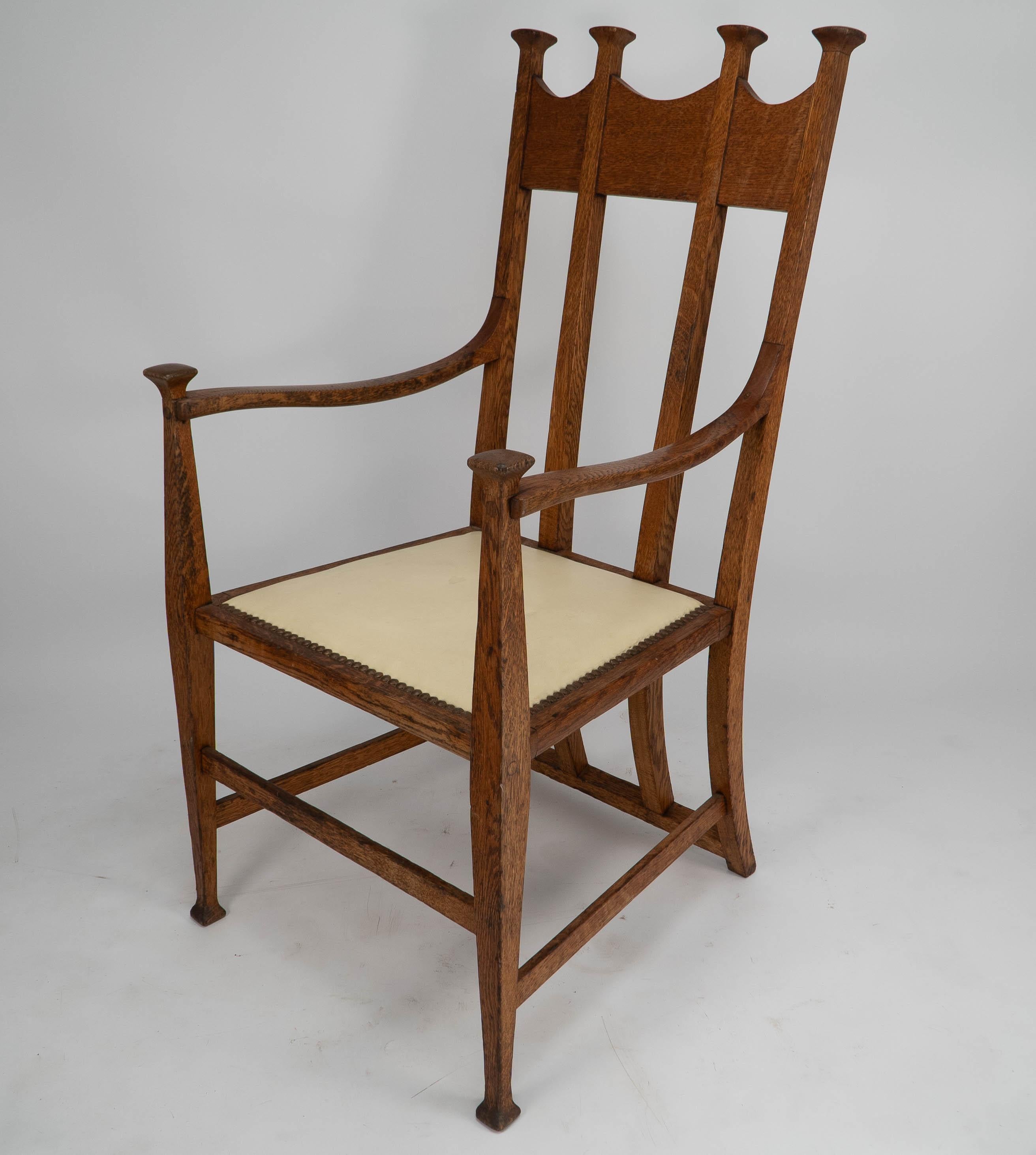 Arts and Crafts G M Ellwood for J S Henry. Arts & Crafts oak throne armchair with capped finials For Sale
