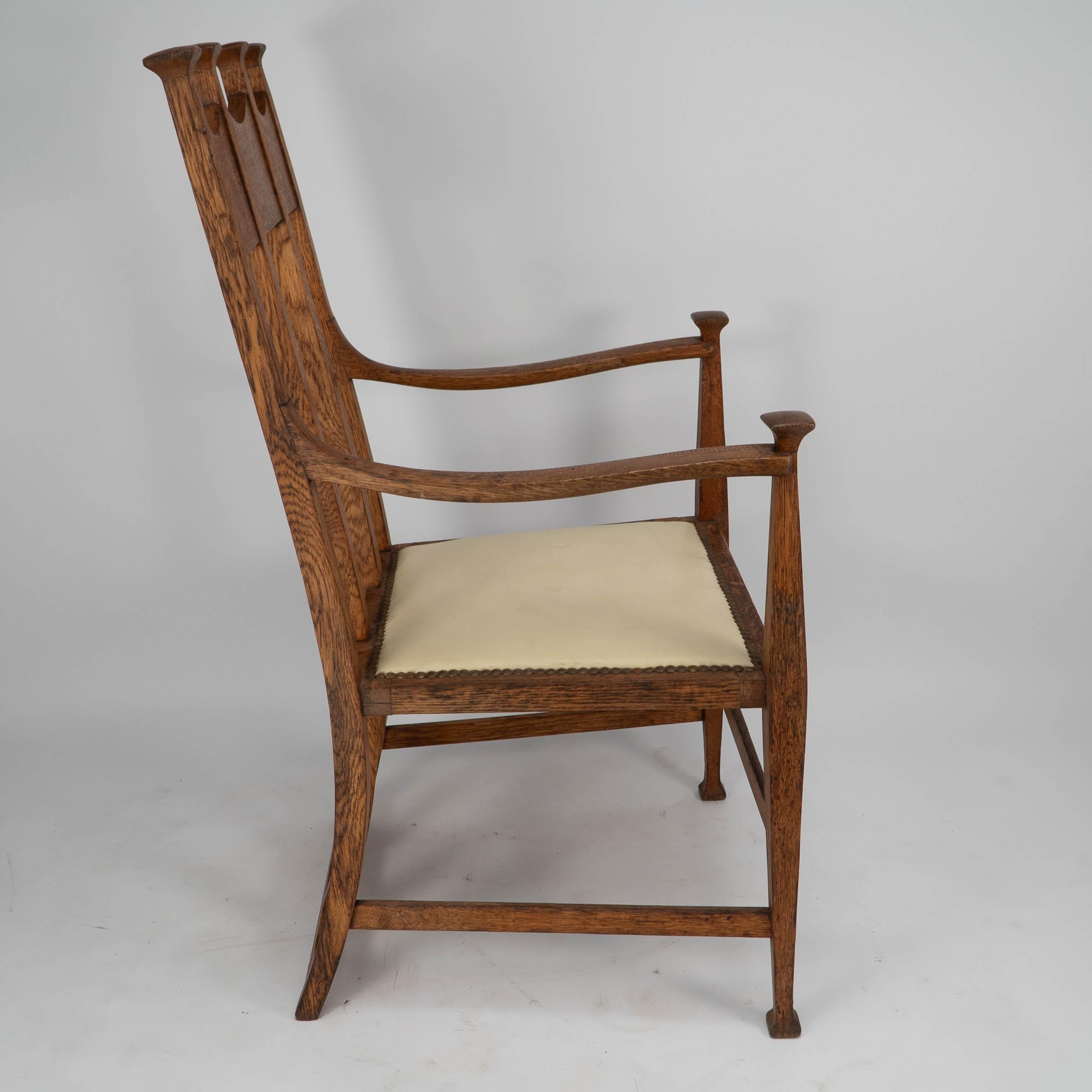 English G M Ellwood for J S Henry. Arts & Crafts oak throne armchair with capped finials For Sale