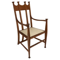 G M Ellwood para J S Henry. Sillón trono Arts & Crafts de roble con remates rematados