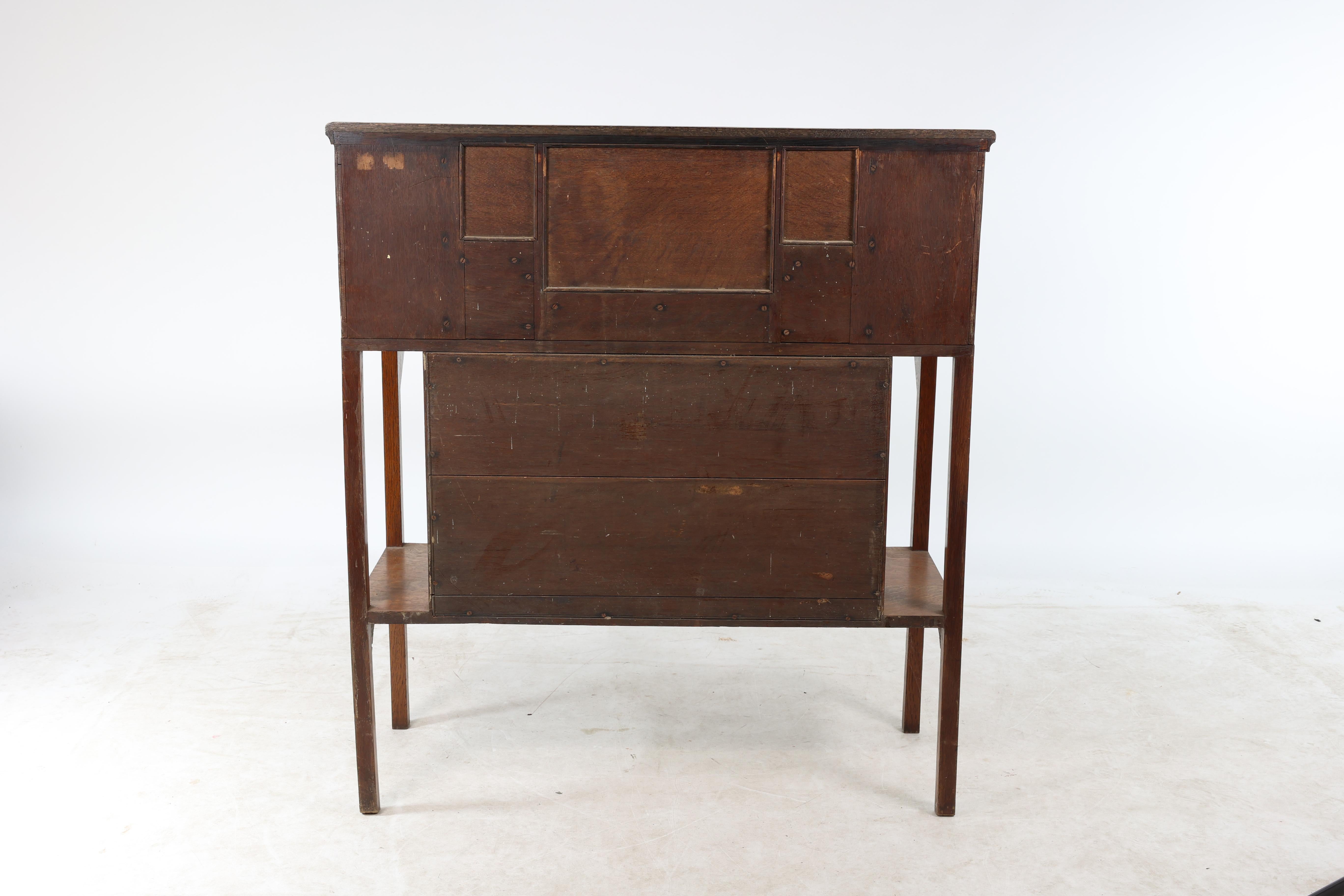 G M Ellwood for J S Henry. An Arts & Crafts oak writing desk For Sale 7