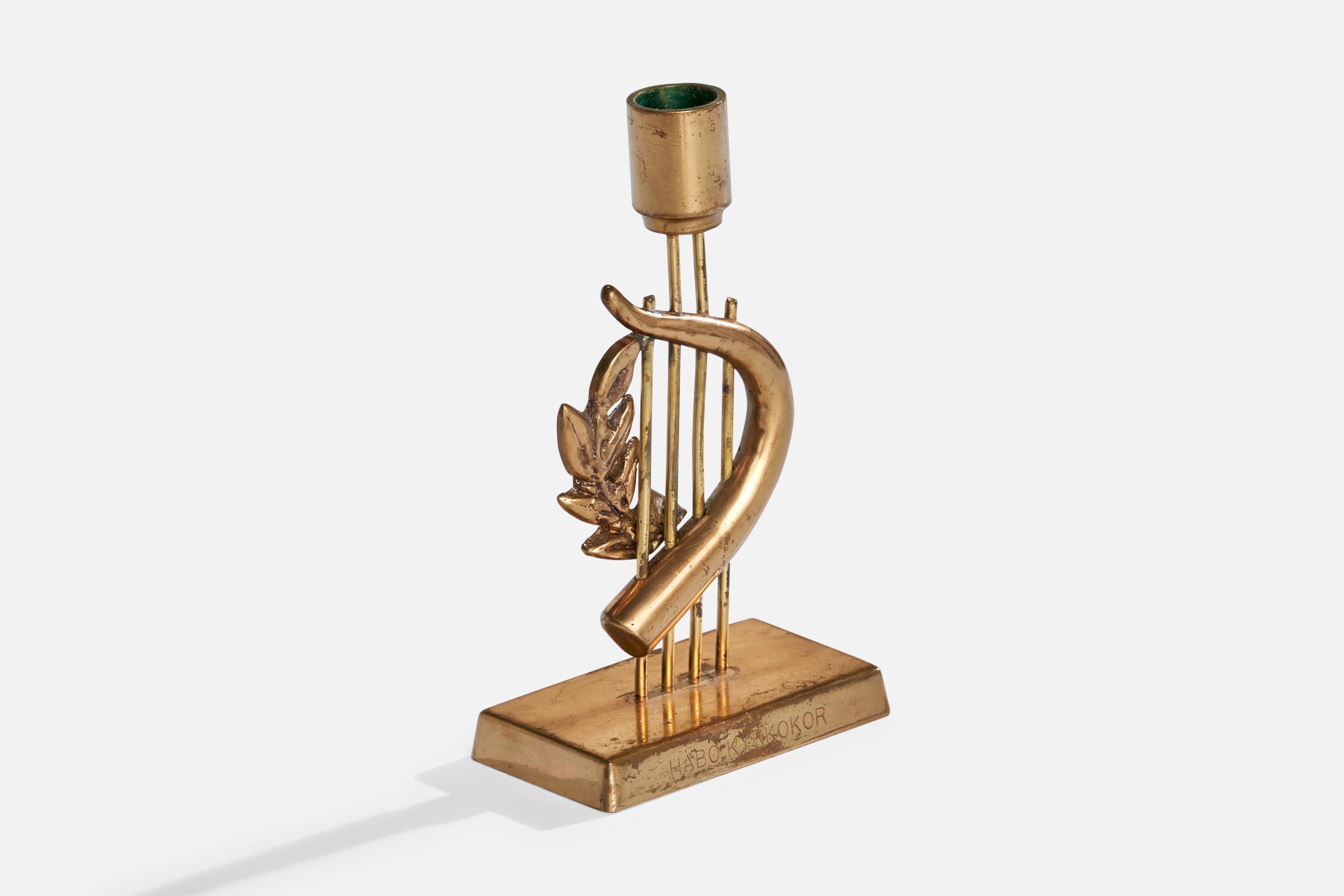 Un candeliere in ottone progettato e prodotto da G. Magnusson Design, Svezia, datato 1974.

Dimensioni: 6