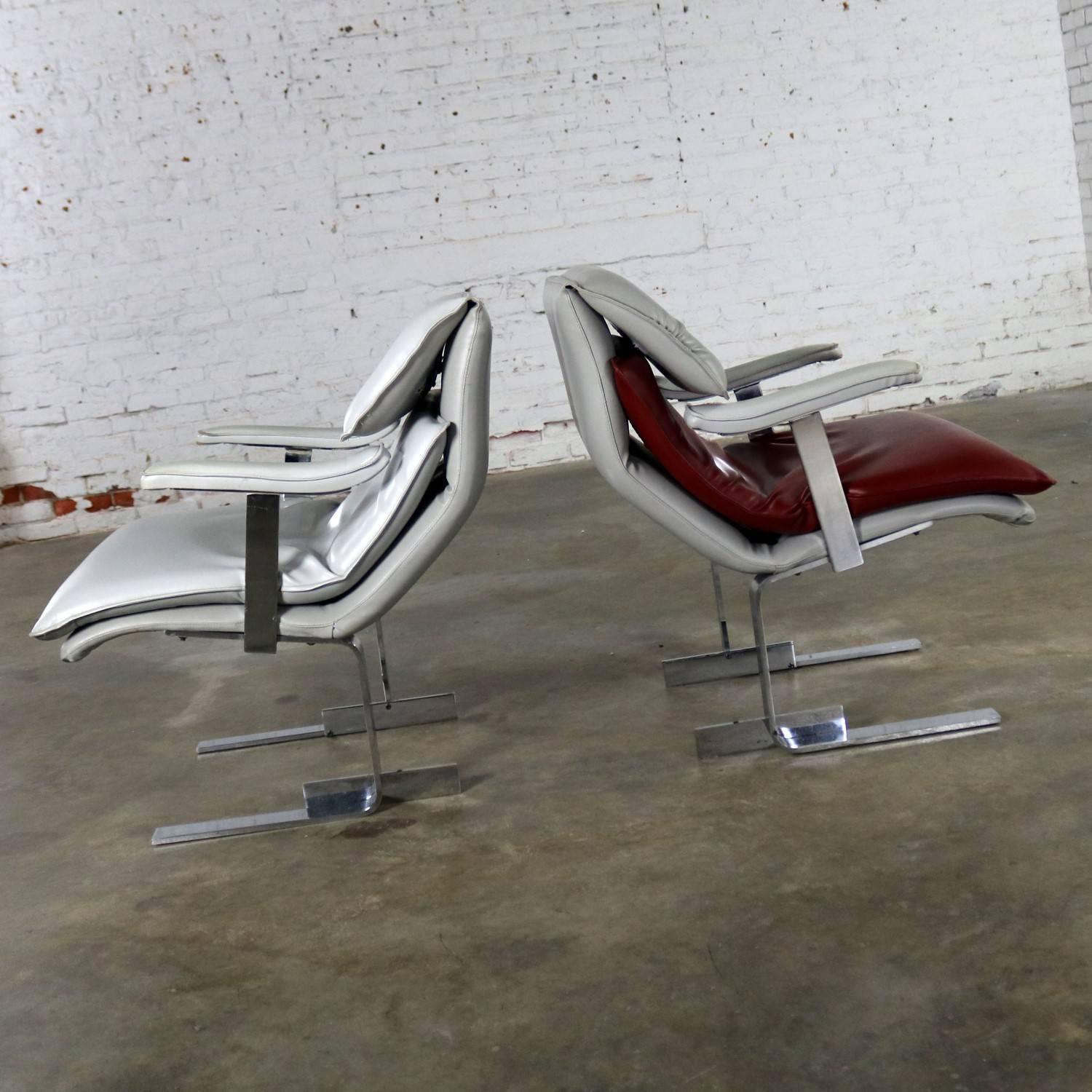 Two handsome lounge chairs produced by G. Maletti. These chairs are made in the style of the Onda chair by Giovanni Offredi for Saporiti Italia. They are in wonderful vintage condition. The chrome has minor scratching as you would expect with age.