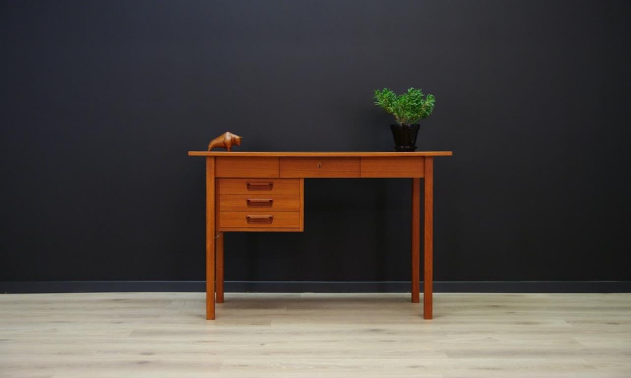 Original Danish desk from the 1960s-1970s, a fantastic form, designed by Gunnar Nielsen Tibergaard. Veneered top with teak, handles and teak legs. The desk has four capacious drawers. No key. Preserved in good condition (small dings and scratches,