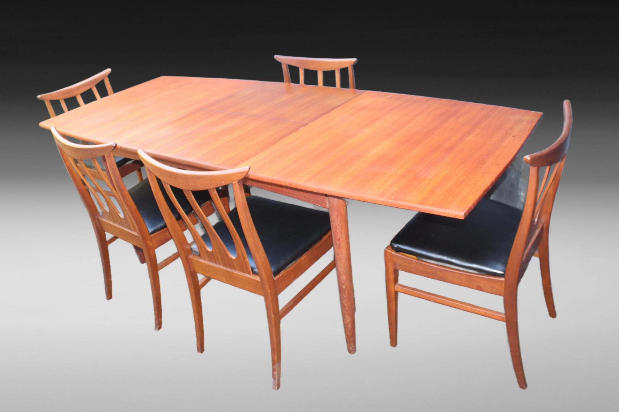 Mid-Century A Younger Extending Dining Table & G Plan Chairs
Mid-Century A Younger Extending Dining Table & 5 G Plan Brasilia Teak Chairs

Upgrade your dining space with this Mid-Century A Younger extending dining table paired with five beautifully