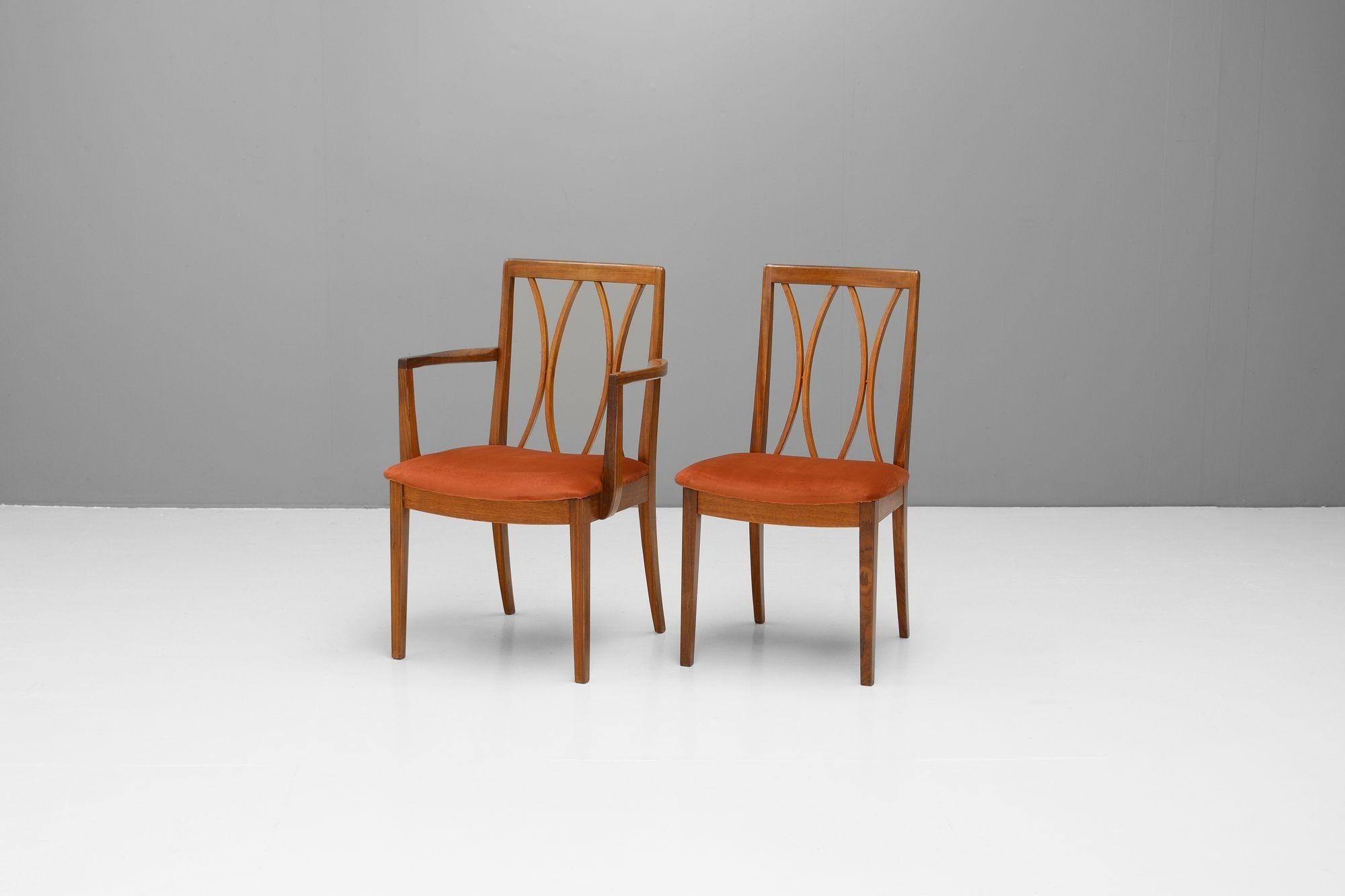 Set of six G-Plan dining chairs, four side chairs and two calver chairs. Newly upholstered in a burnt orange velvet. Fully restored. U.K circa 1960.
H 87cm (SH 46cm) x W 49/56cm x D 52cm