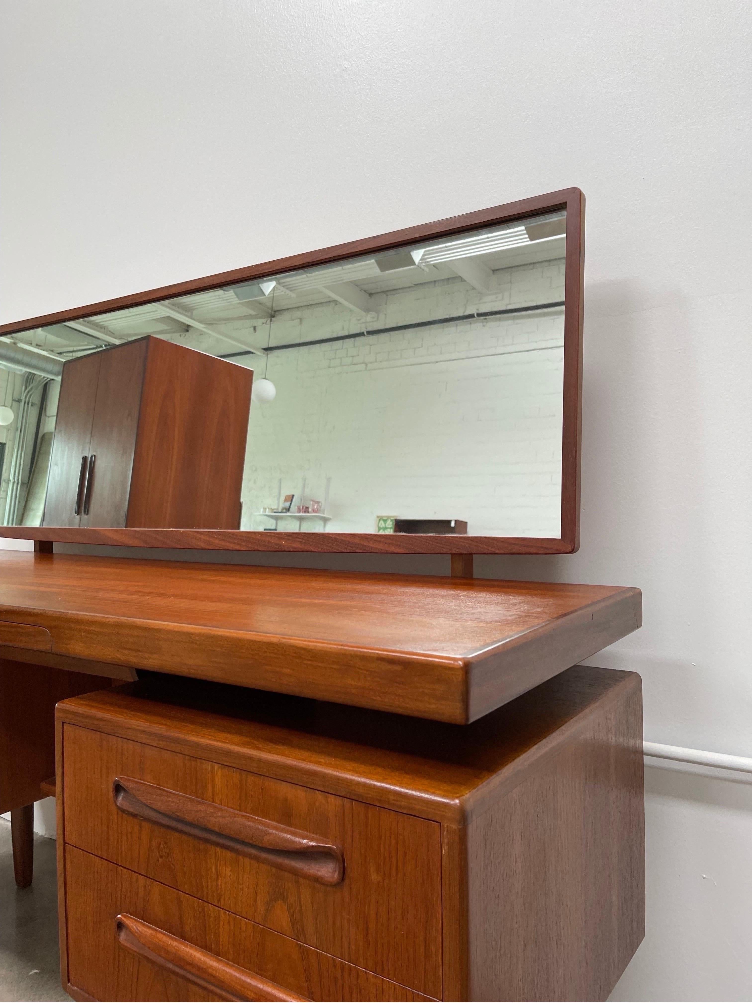 Teak vanity by British furniture maker G-Plan from their Fresco series dating back to the 1960’s. Love the long sculptural wooden pulls and floating top! The warm teak and afromosia wood tones add an earthy element to the space. It even has a hidden