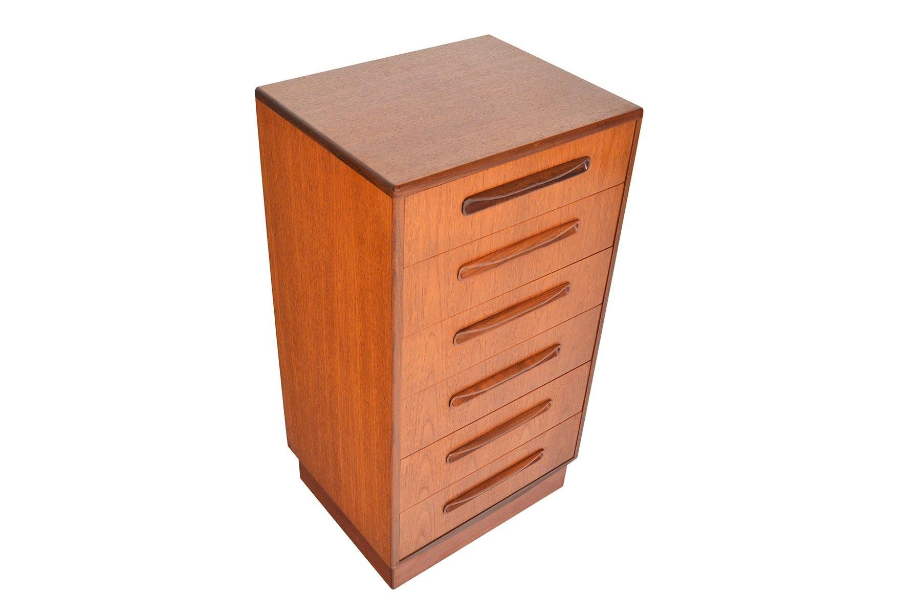 This English modern G Plan Fresco lingerie chest was designed by Victor Wilkins in the 1960s. This fantastic dresser features six deep drawers with solid teak drawer fronts and carved afrormosia pulls. With its slender design, this piece is perfect