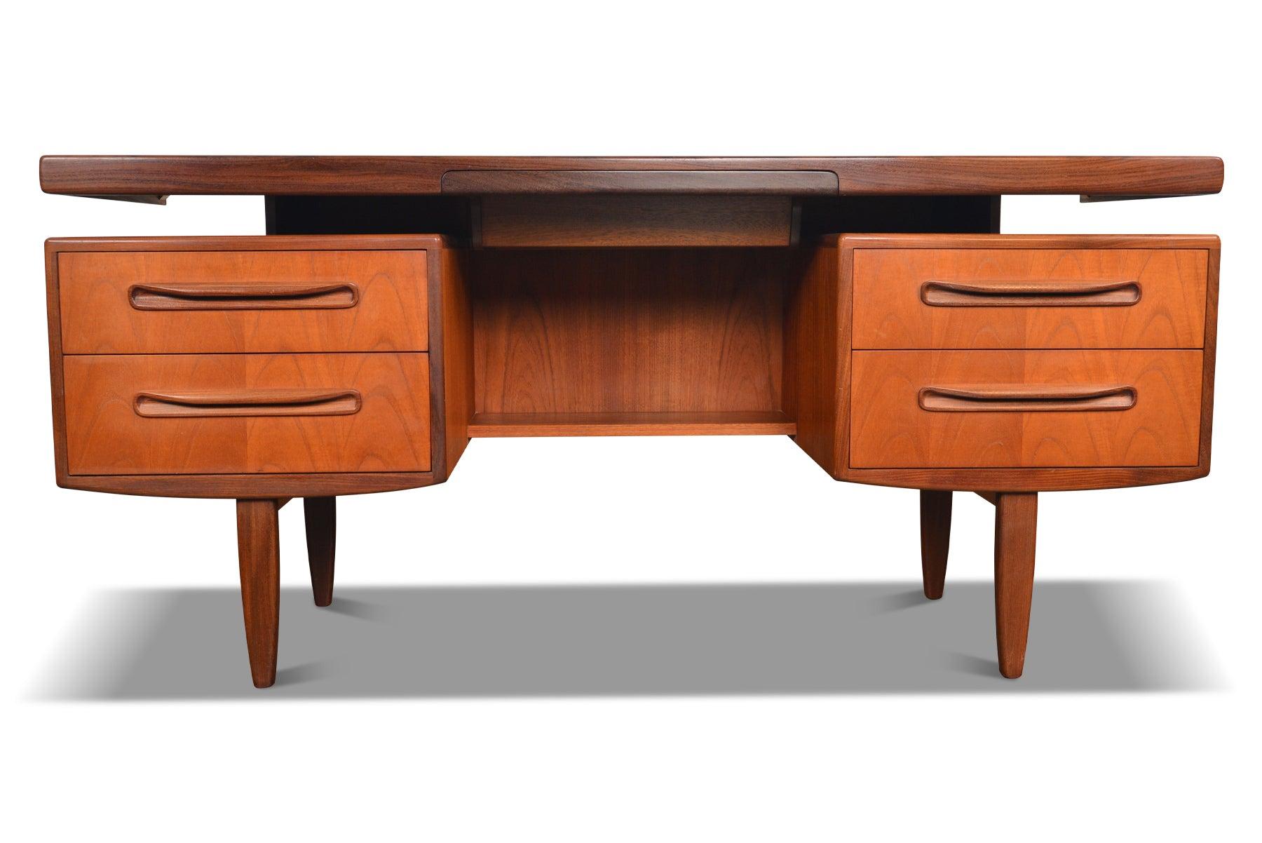 Origin: England
Designer: Victor B. Wilkins
Manufacturer: G Plan
Era: 1966
Materials: Teak, Afromosia
Measurements: 60? wide x 18? deep x 27.5? tall (floor to top of desk)

Condition: In excellent original condition.