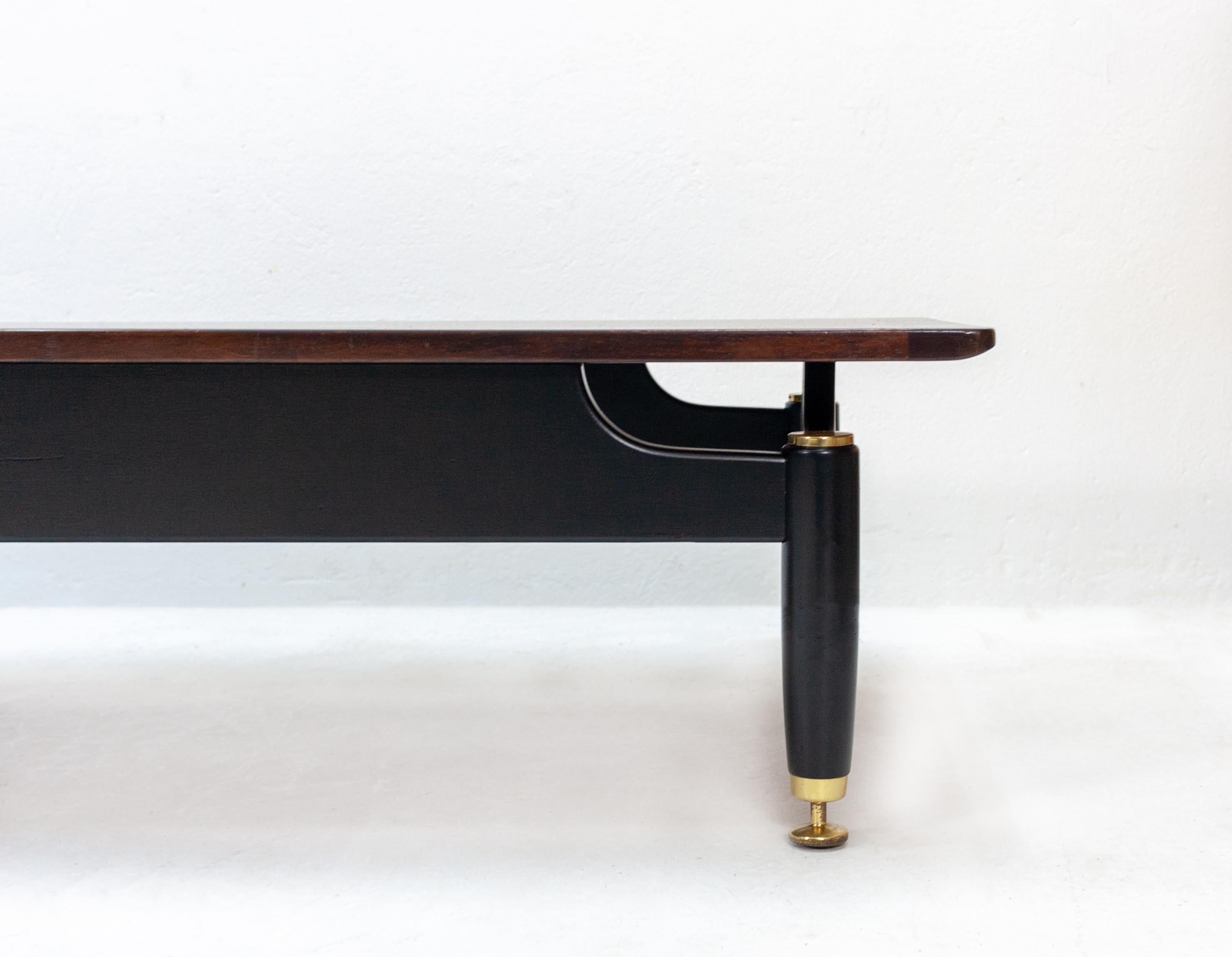 G-Plan long John teak coffee table with brass hardware, designed by G. Romme.
Very nice and unusual low-slung design. Made in England, 1960s.