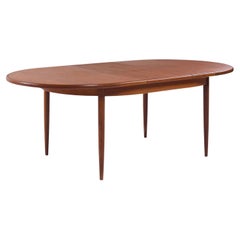 G-Plan Tavolo da pranzo allungabile a foglie nascoste in teak del metà del secolo scorso
