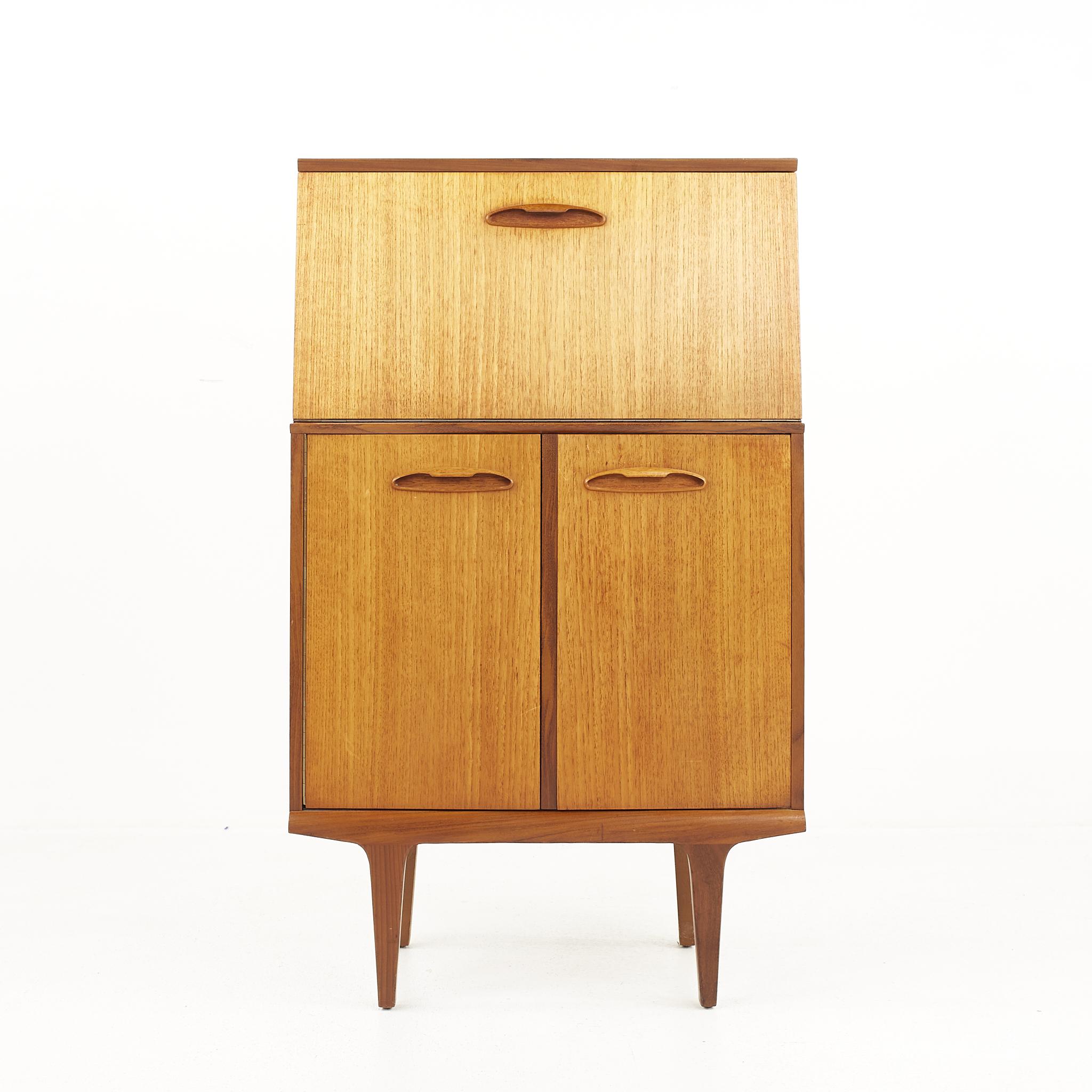 G plan style mid century teak bar cabinet

The cabinet measures: 24 wide x 11.75 deep x 39.75 inches high

All pieces of furniture can be had in what we call restored vintage condition. That means the piece is restored upon purchase so it’s free