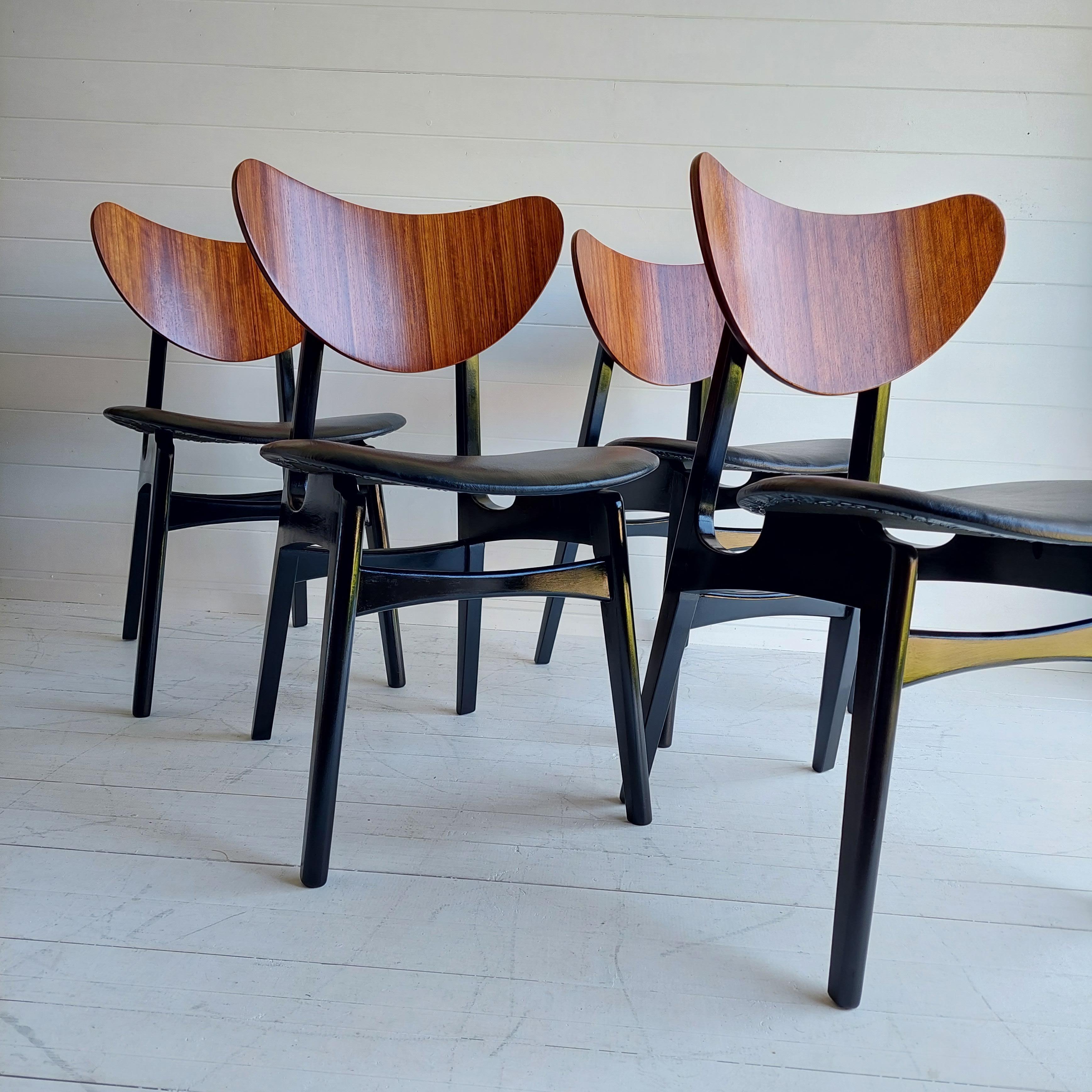 The black lacquered legs and new black vinyl fabric contrast beautifully with the deep warmth of the Tola mahogany backs.
Altogether, it is a set that would make any dining area stand out for its cool and bold style.

Tola and Black was E.