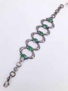 Armband von G. Verdi aus 18 Karat geschwärztem Gold, blauem Saphir, Diamant und Tsavorit