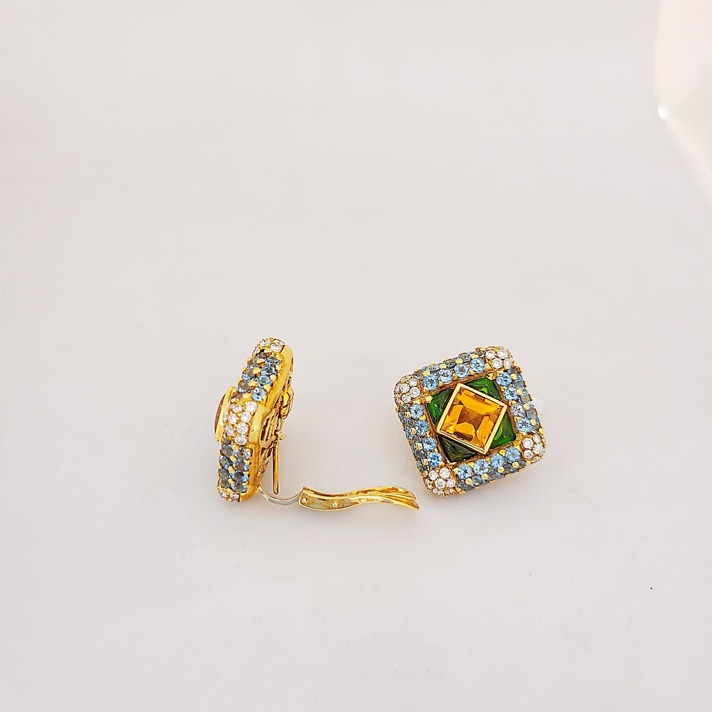 G. verdi of Italy, is known for their outstanding craftsmanship and extraordinary use of color. These earrings center 2.50Ct. Cabochon Citrines, surrounded by Cabochon Tsavorites and round brilliant cut Blue topaz. Semi precious weight totals