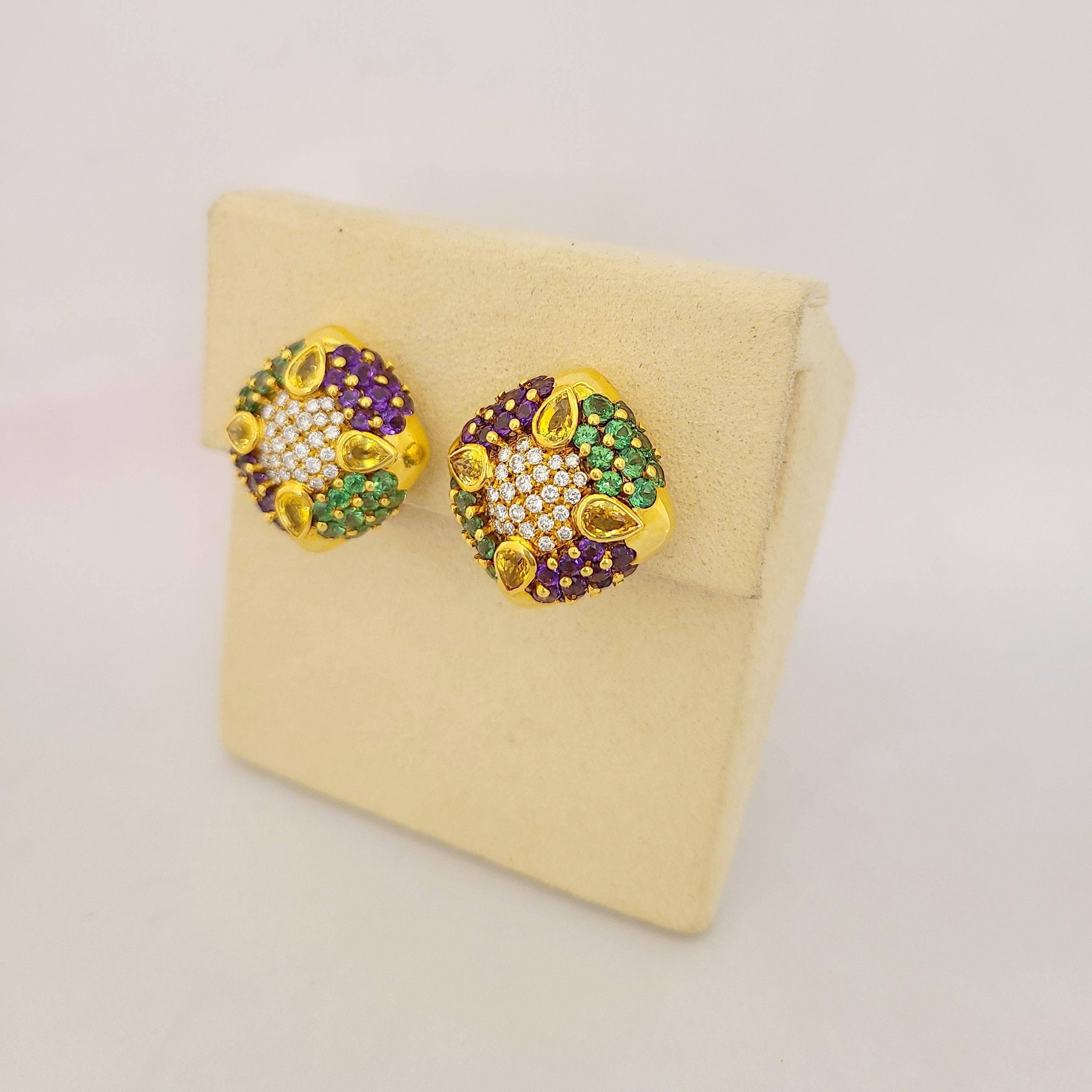 G. verdi of Italy earrings are beautifully crafted in 18 Karat yellow gold, and set with 3.07Ct. of pear shapes yellow sapphires and embellished with amethysts & green tourmaline. The color combination and gem cut variety make for a truly special