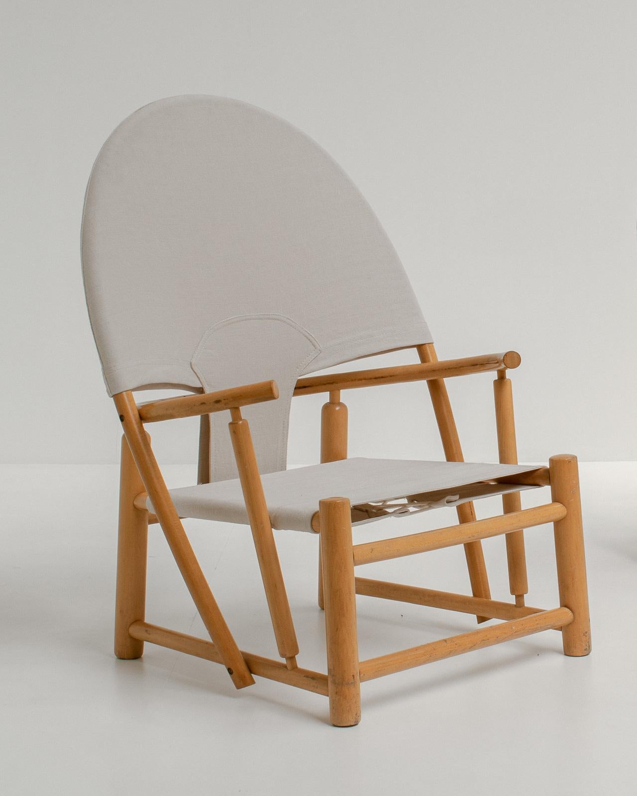 This very unique and unusual chair is the G23 lounge chair that was designed by Piero Palange & Werther Toffoloni. It was produced by Germa in 1972 and became known as the 'hoop' chair.

This is a high-quality chair, with a steam-bend beech frame.