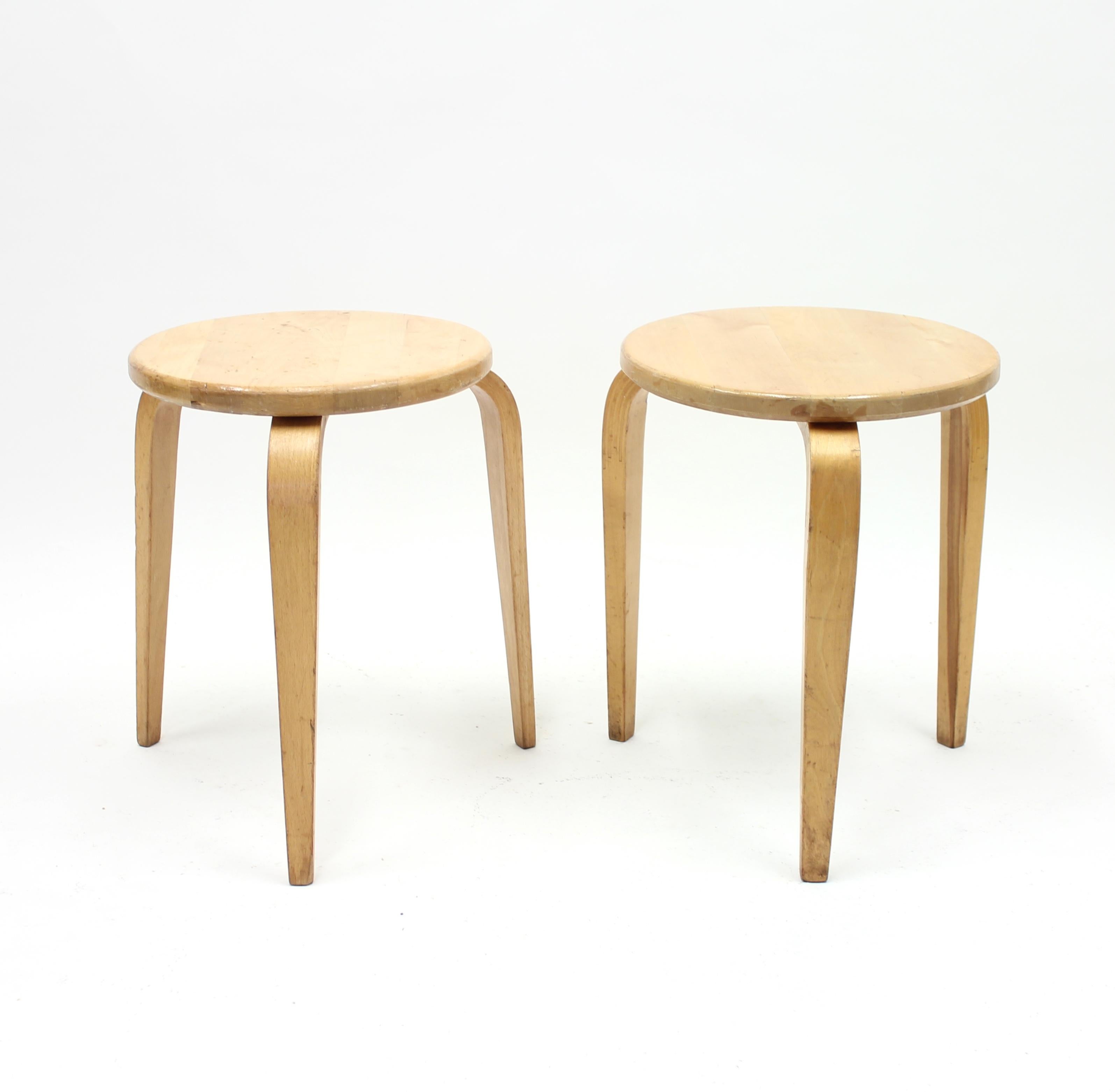 Pair of stools designed by Swedish modernist G.A. (Gustaf Axel) Berg in the 1940s. They of course have some resemblance with the very famous Alvar Aalto stool, model 60. Berg actually had a his own furniture shop in Stockholm in the early 1940s and