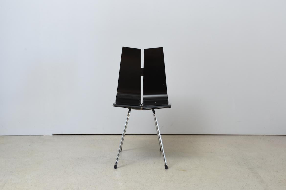 GA chair by Hans Bellmann for Horgenglarus, Switzerland, 1950s playwood black lacquered, base in polished metal, circa 1954. The black paint of the seat has some wear (see images).