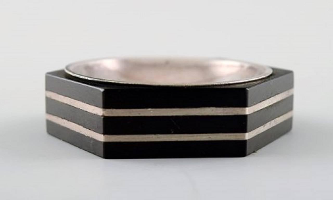 GAB (Guldsmedsaktiebolaget) Art Deco hexagonal salt cellar in silver and ebony with matching salt spoon.
Sweden, 1936.
Measures 5.5 cm. x 1.2 cm.
Marked.
In very good condition.