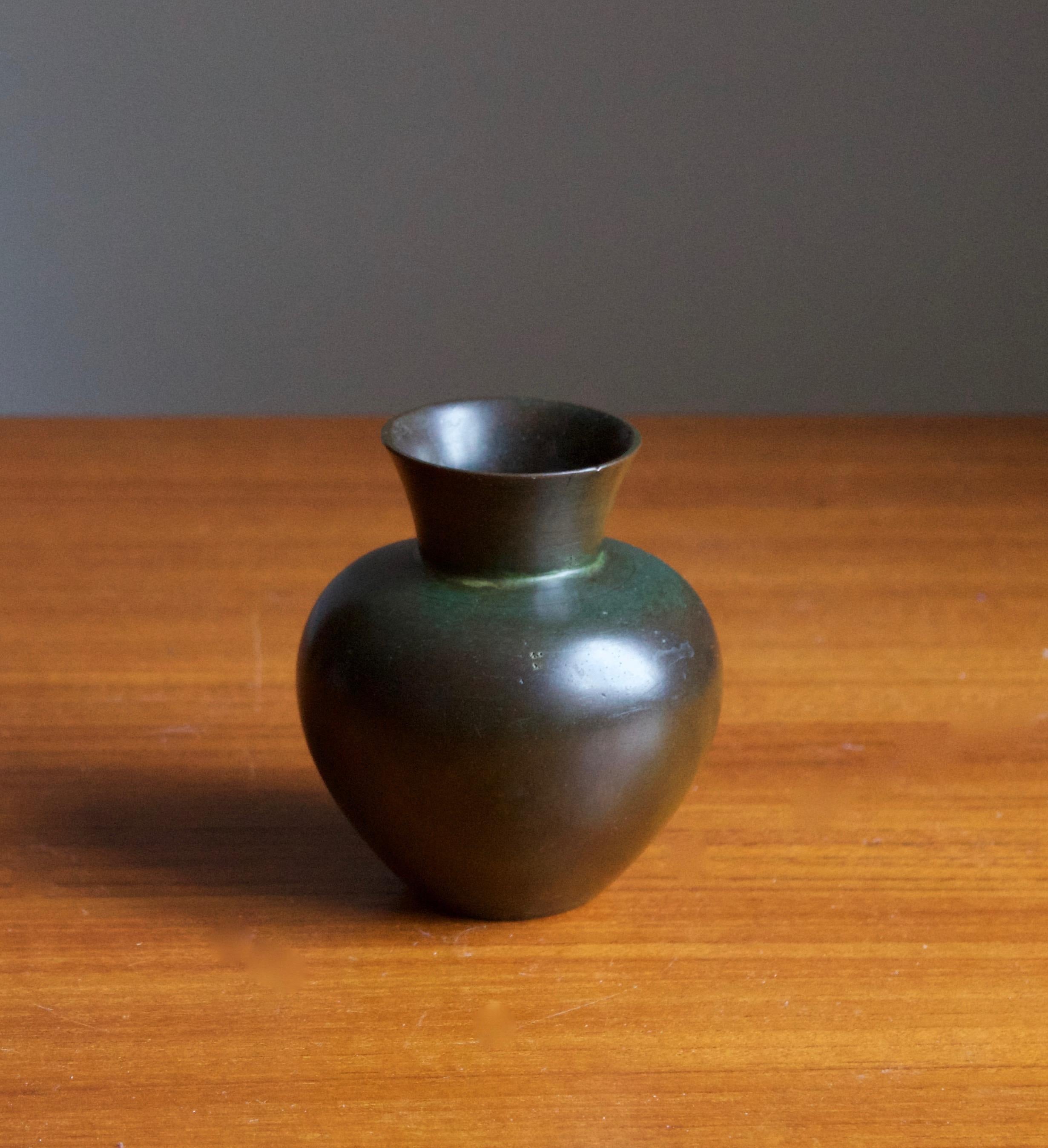 A small vase, designed and produced by GAB, stamped with makers mark, Sweden, 1930s. In cast bronze.

Other designers of the period include Josef Frank, Kaare Klint, Estrid Ericson, and Just Andersen.
  