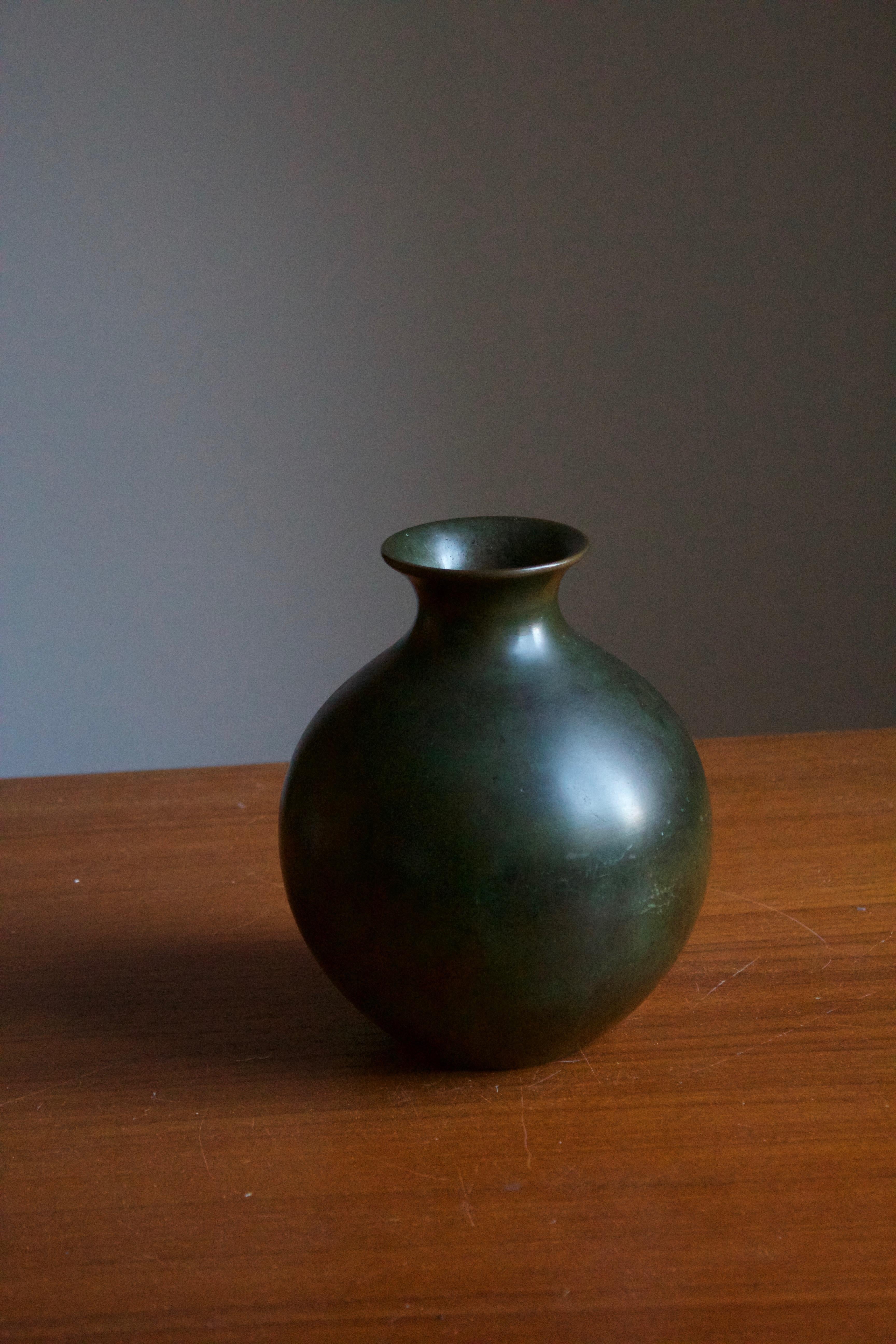 A vase or vessel, produced by GAB, stamped with makers mark, Sweden, 1930s-1940s. In cast bronze. 

A sizable vase compared to the majority of works produced by GAB that are often intimate in scale.

Other designers of the period include Josef