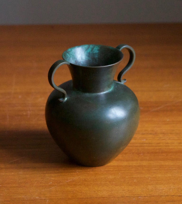 A vase or vessel, designed and produced by GAB, stamped with makers mark, Sweden, 1930s. In cast bronze. 

Other designers of the period include Josef Frank, Kaare Klint, Estrid Ericson, and Just Andersen.
     