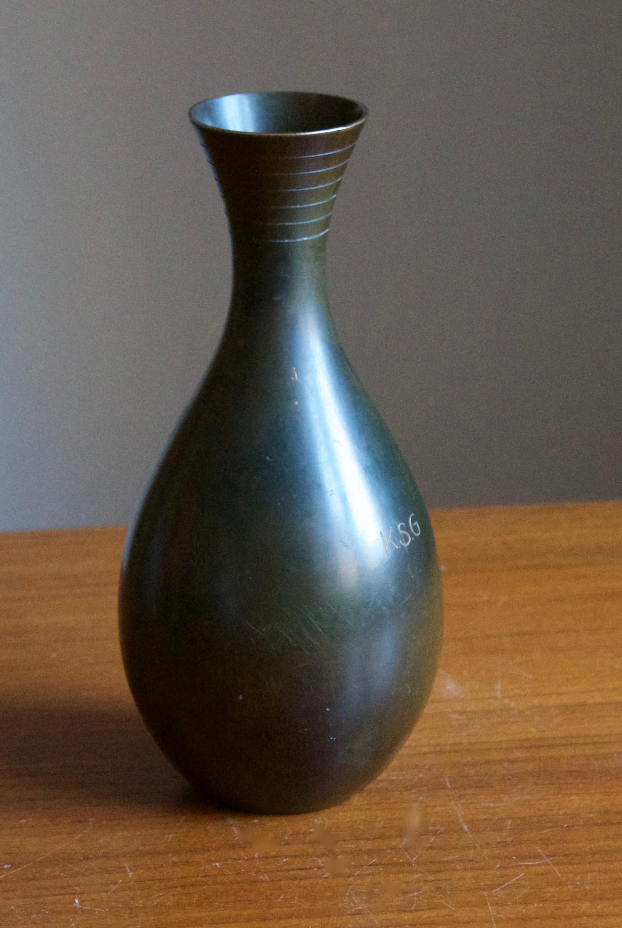 A vase or vessel, designed and produced by GAB, stamped with makers mark, Sweden, 1930s-1940s. In cast bronze. With inscription.

Other designers of the period include Josef Frank, Kaare Klint, Estrid Ericson, and Just Andersen.
 