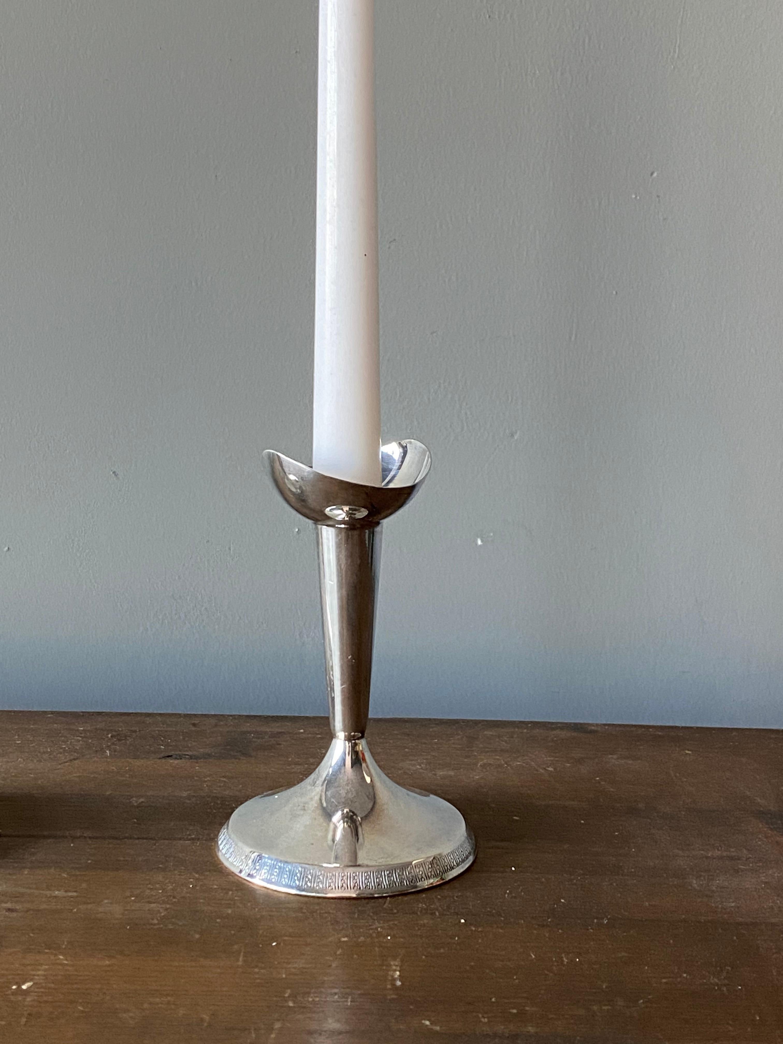 A set of modernist candlesticks. Designed and produced by GAB, Guldsmedsaktiebolaget, Sweden, 1930s. Marked. In sterling silver.



 