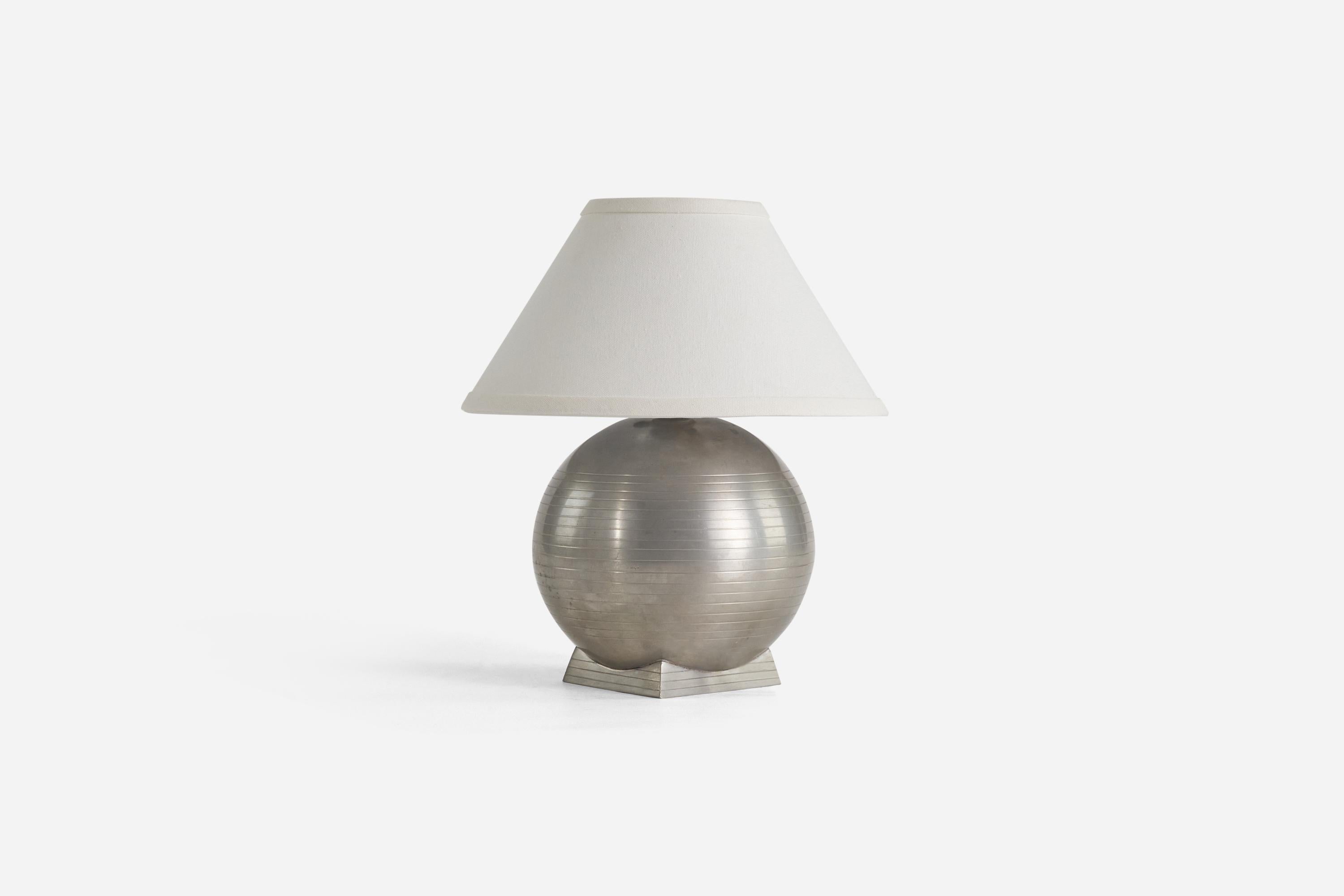 A pewter table lamp designed and produced by GAB Guldsmedsaktiebolaget, Sweden, 1930s. 

Sold without Lampshade(s)
Dimensions of Lamp (inches) : 9.81 x 7 x 7 (Height x Width x Depth)
Dimensions of Shade (inches) : 4.25 x 10.25 x 6 (Top Diameter x