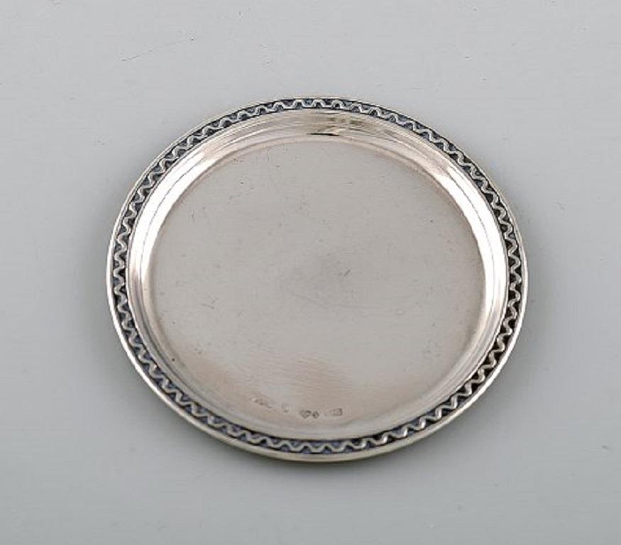 GAB, Sweden. Eight silver coasters dated 1967.
Measures: 7.7 cm.
Stamped and dated.
In very good condition.