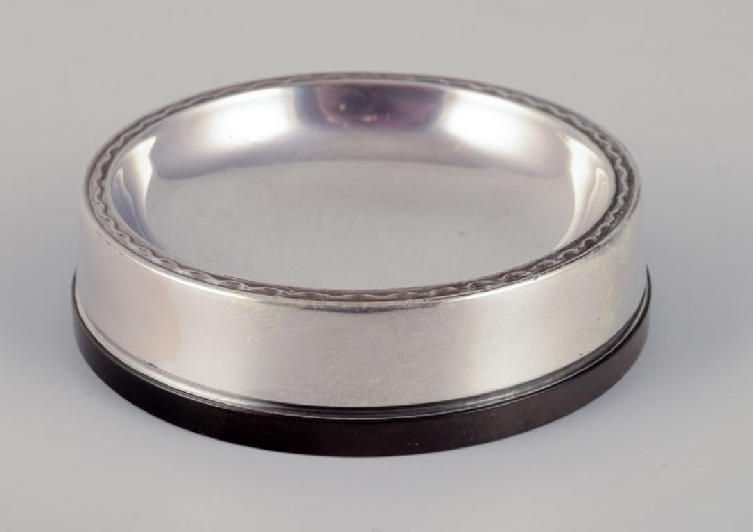 GAB, Sweden. Four salt cellars in 830 silver and bakelite. 
Art Deco style.
1960s
Hallmarked.
In excellent condition.
Dimensions: Diameter 7.0 cm x Height 1.9 cm.