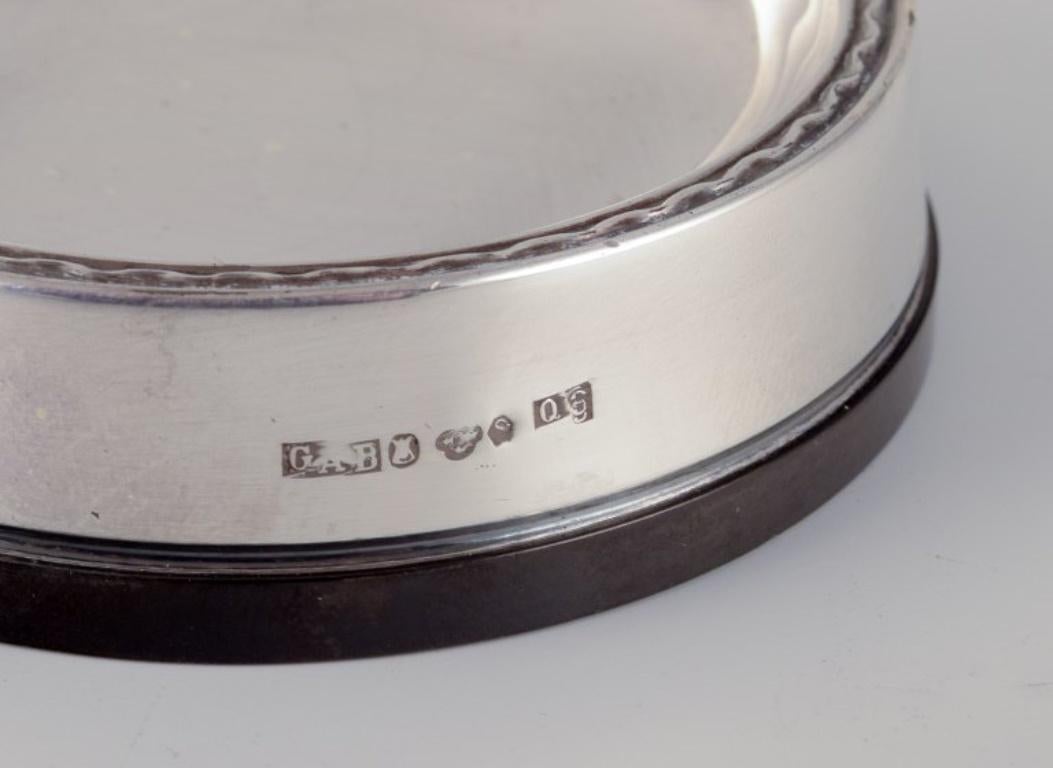 Swedish GAB, Sweden. Four salt cellars in 830 silver and bakelite. Art Deco style. For Sale