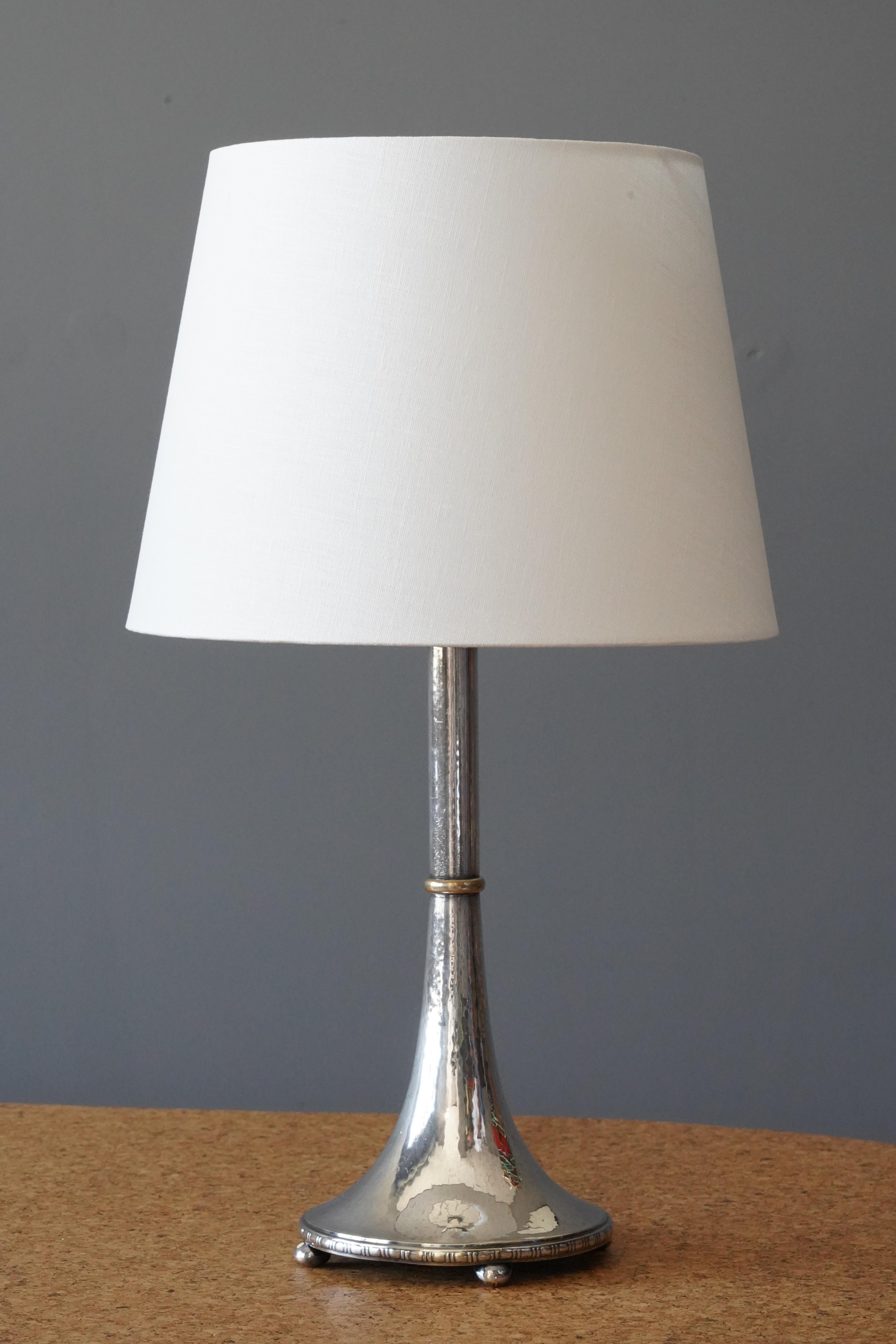 A table lamp by GAB Guldsmedsaktiebolaget. Designed and produced c. 1930s. Stamped.

Sold without lampshade. Stated dimensions exclude lampshade.