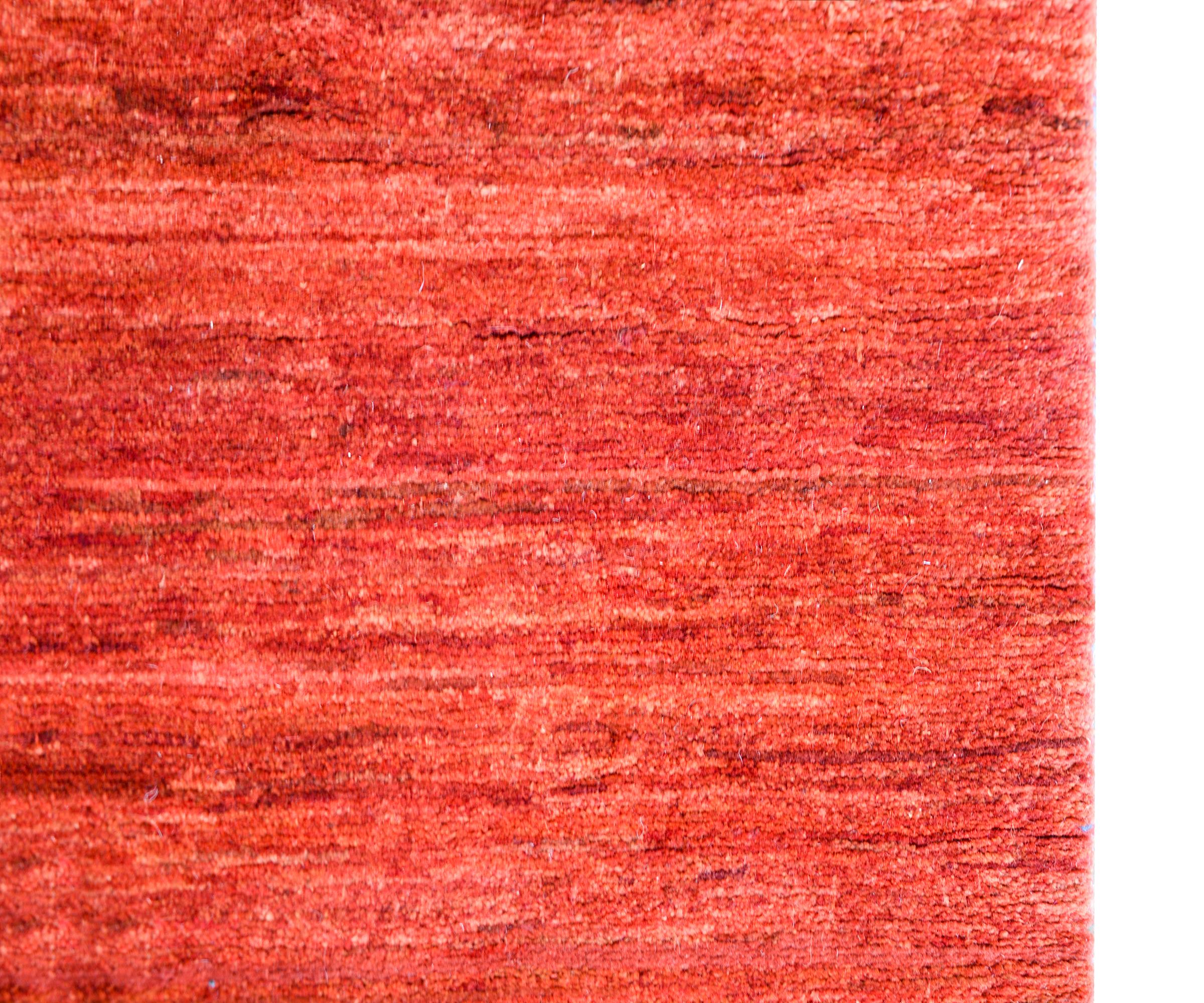 A wonderful vintage Gabbeh rug with a wonderful all-over abrash crimson field with no border.