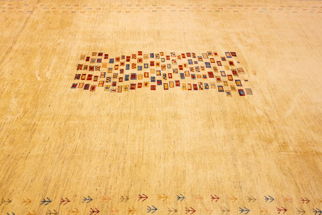 This magnificent Gabbeh Royal carpet is truly a work of art. It’s beautiful, minimal design is perfect for adding a touch of luxury to any room. The carpet is hand-woven from the finest quality wool, making it extremely soft and durable. It's also