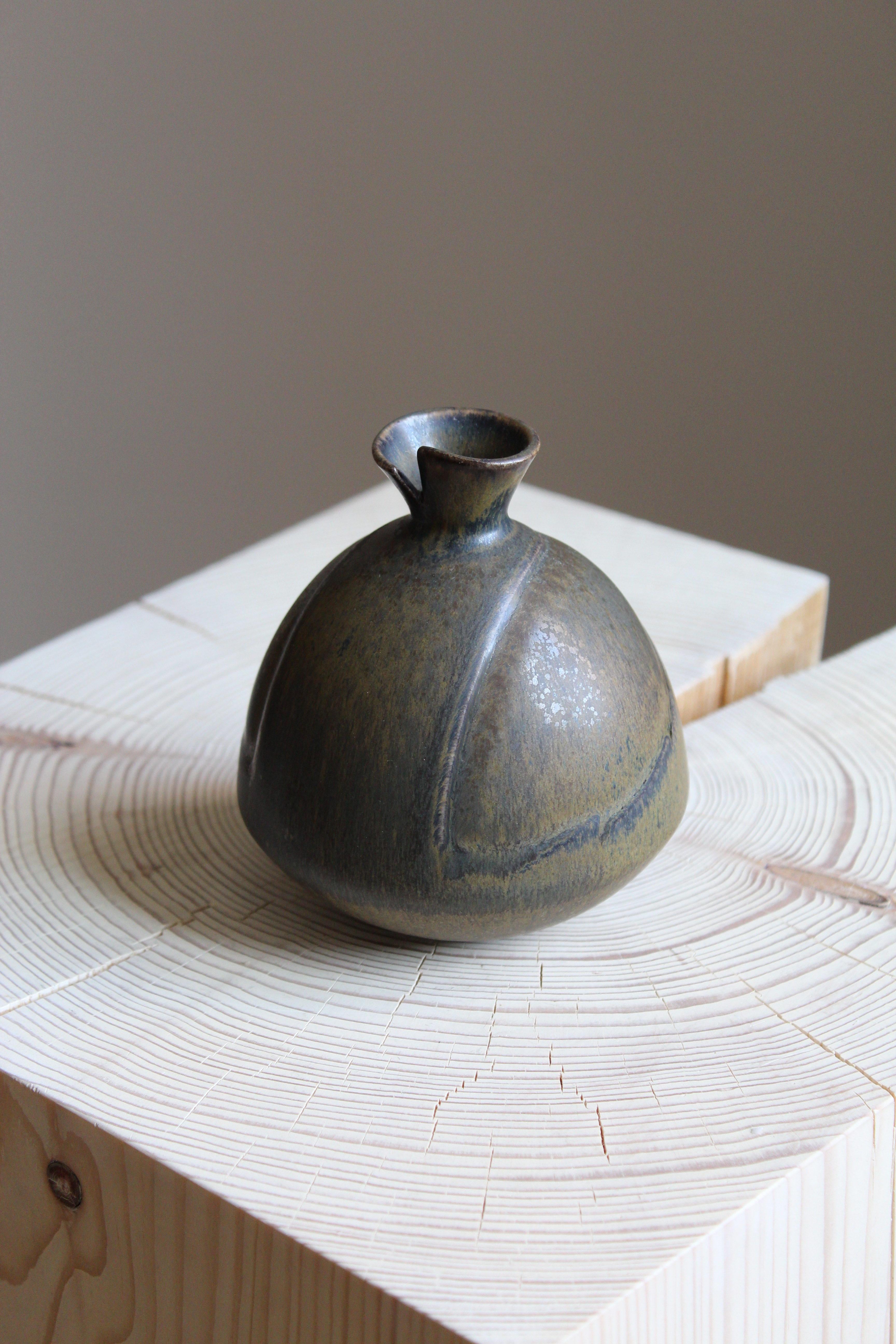 An organically shaped small stoneware vase by Gabi Citron Tengborg for the iconic Swedish firm Gustavsberg. 

Other ceramicists of the period include Berndt Friberg, Axel Salto, Carl-Harry Stålhane and Wilhelm Kåge.