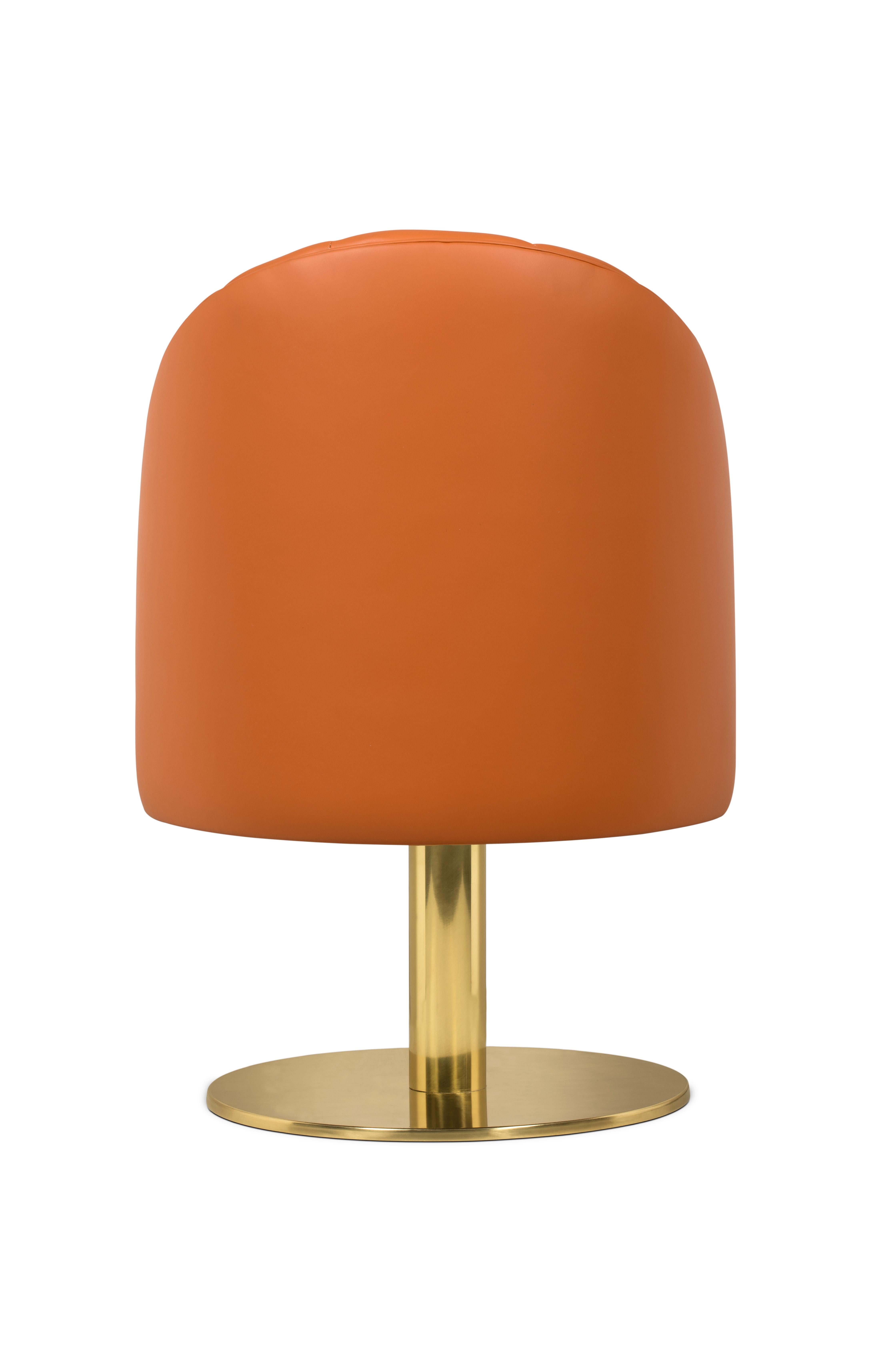 Mid-Century Modern Gable Dining Chair in Soft Orange by Essential Home

Mid-Century Modern Gable Dining Chair in Soft Orange features a round polished brass swivel base that contrasts with the dreamy cotton velvet. Its curved low back has some